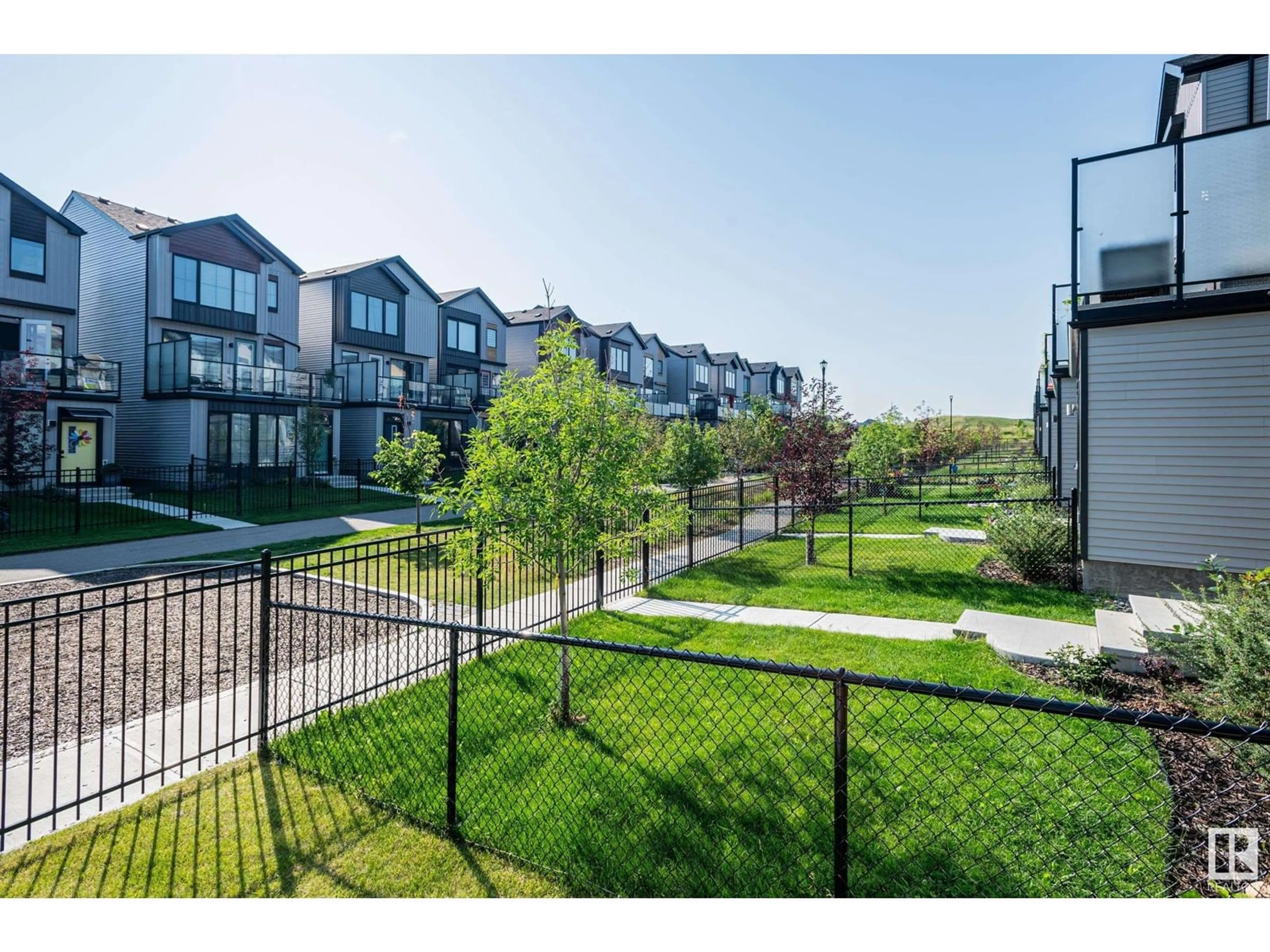 A pic from exterior of the house or condo, the fenced backyard for 439 39 ST SW, Edmonton Alberta T6X2X9