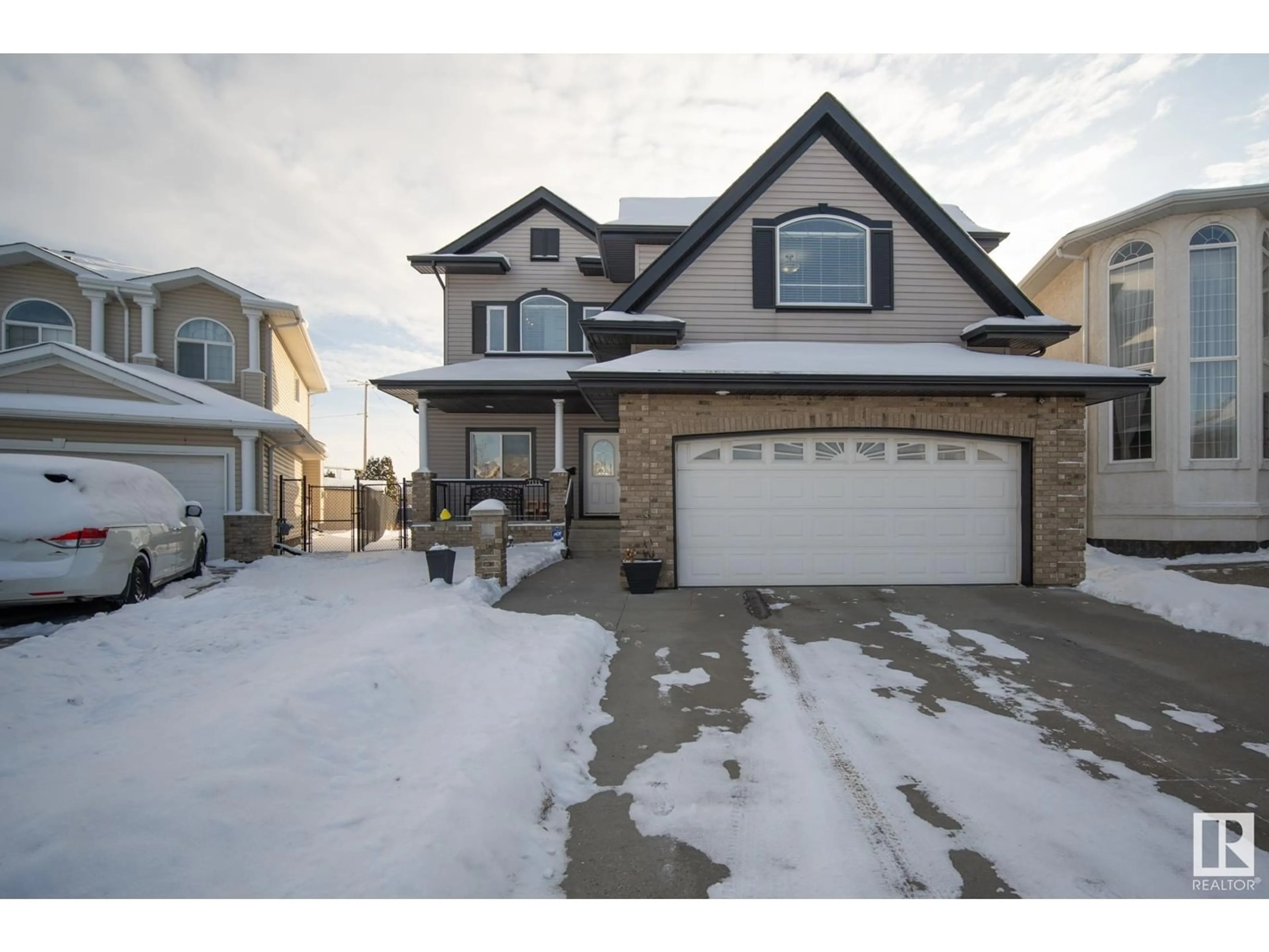 Frontside or backside of a home, the street view for 7111 168 AV NW, Edmonton Alberta T5Z0B5