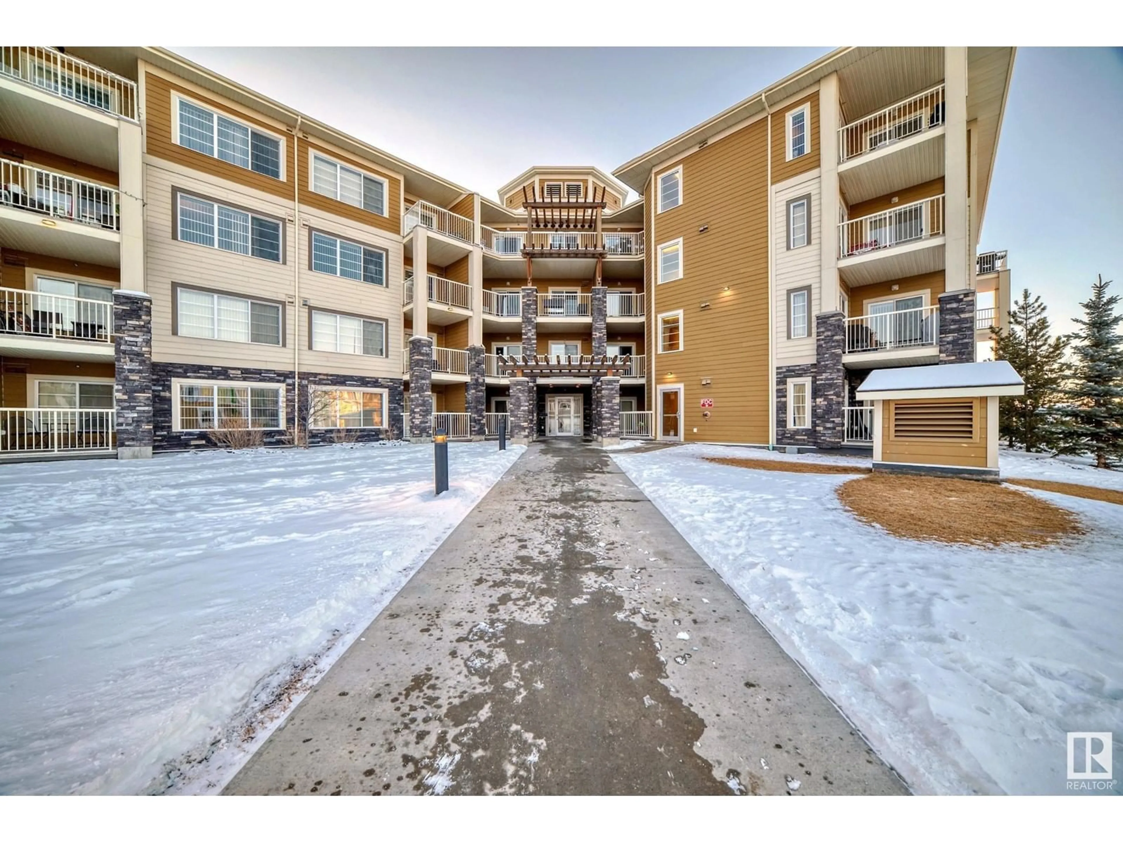 A pic from exterior of the house or condo, the street view for #205 3670 139 AV NW, Edmonton Alberta T5Y3N5