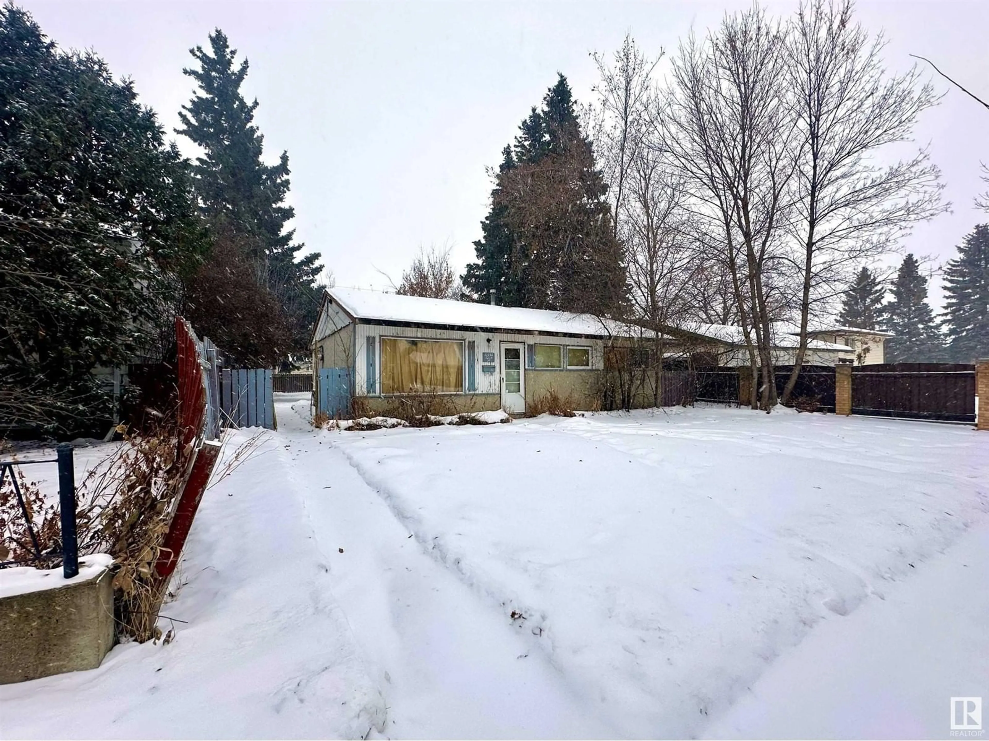 Frontside or backside of a home, the fenced backyard for 13032 123A ST NW NW, Edmonton Alberta T5L0L2