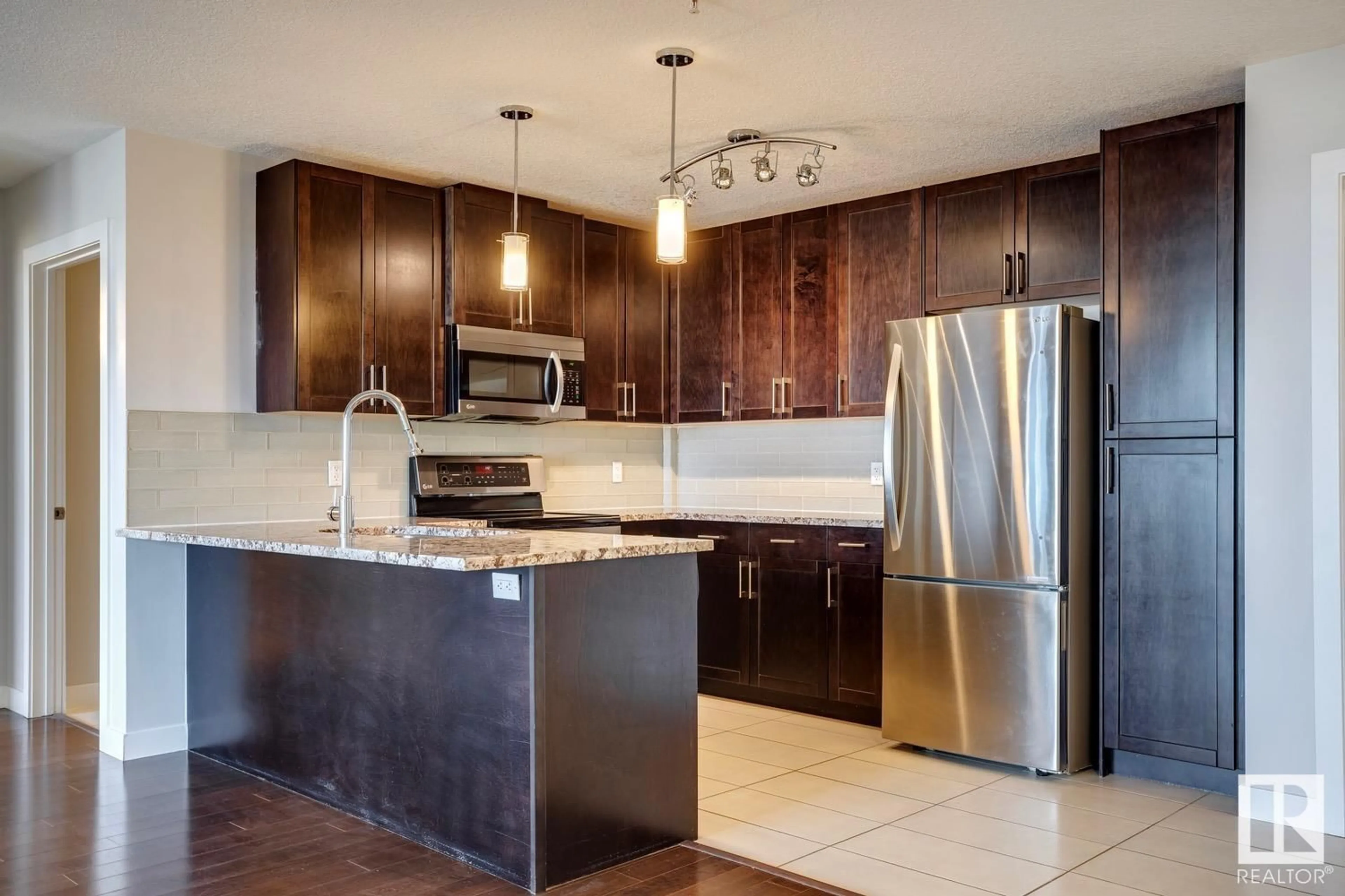 Open concept kitchen for #414 5151 WINDERMERE BV SW, Edmonton Alberta T6W2K4