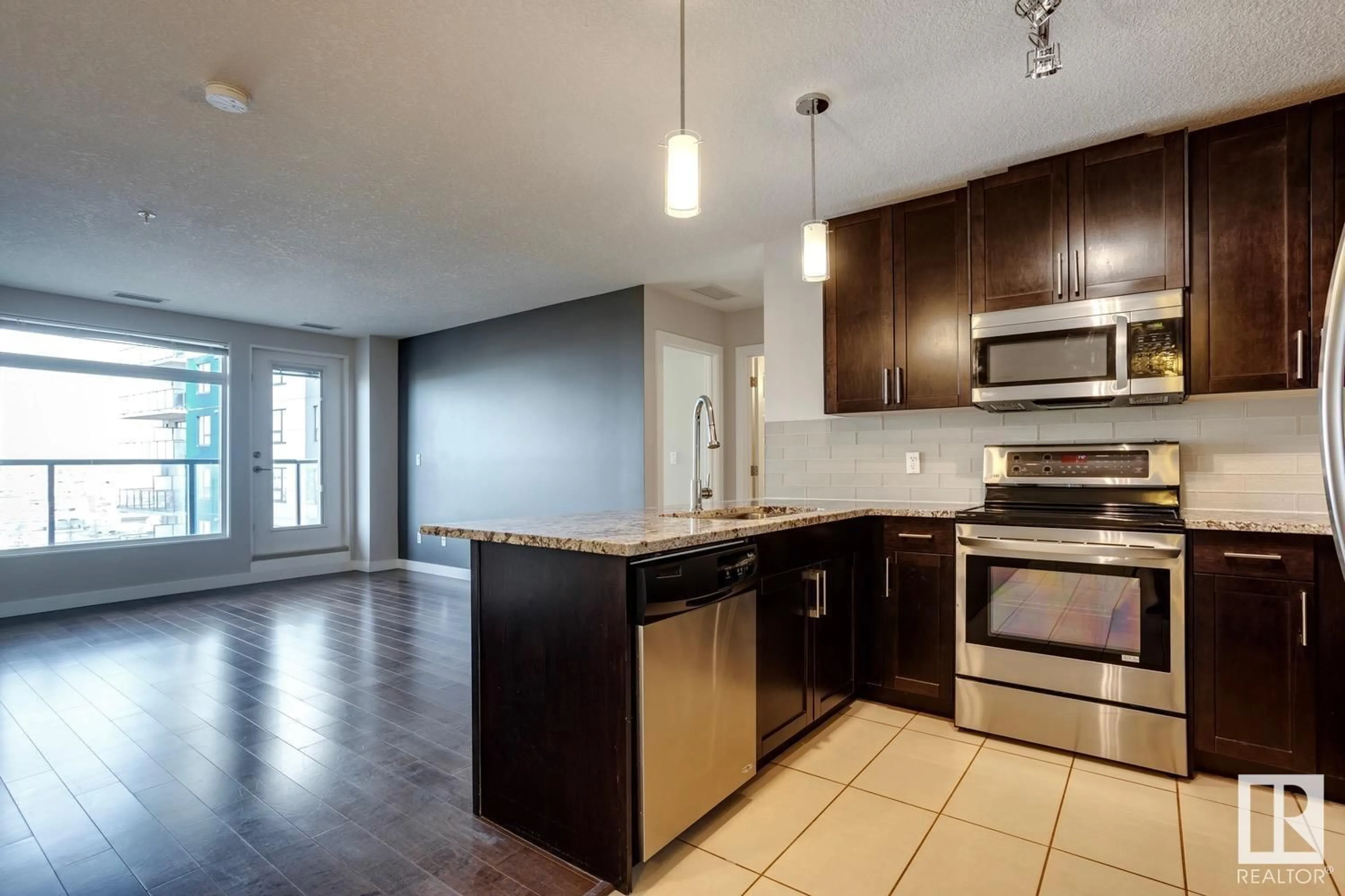 Open concept kitchen for #414 5151 WINDERMERE BV SW, Edmonton Alberta T6W2K4