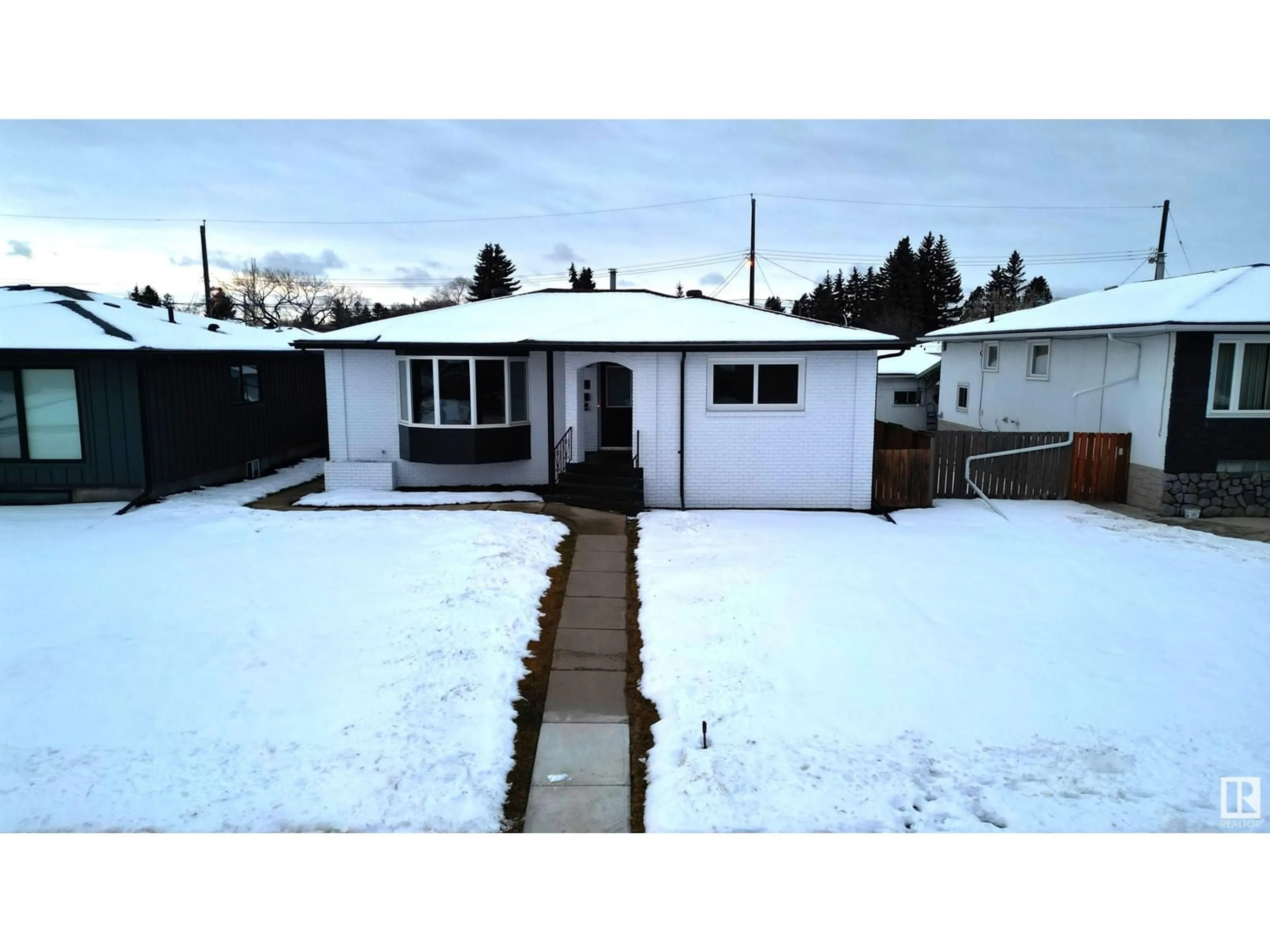 Frontside or backside of a home, the street view for 9216 72 ST NW, Edmonton Alberta T6B1Y7