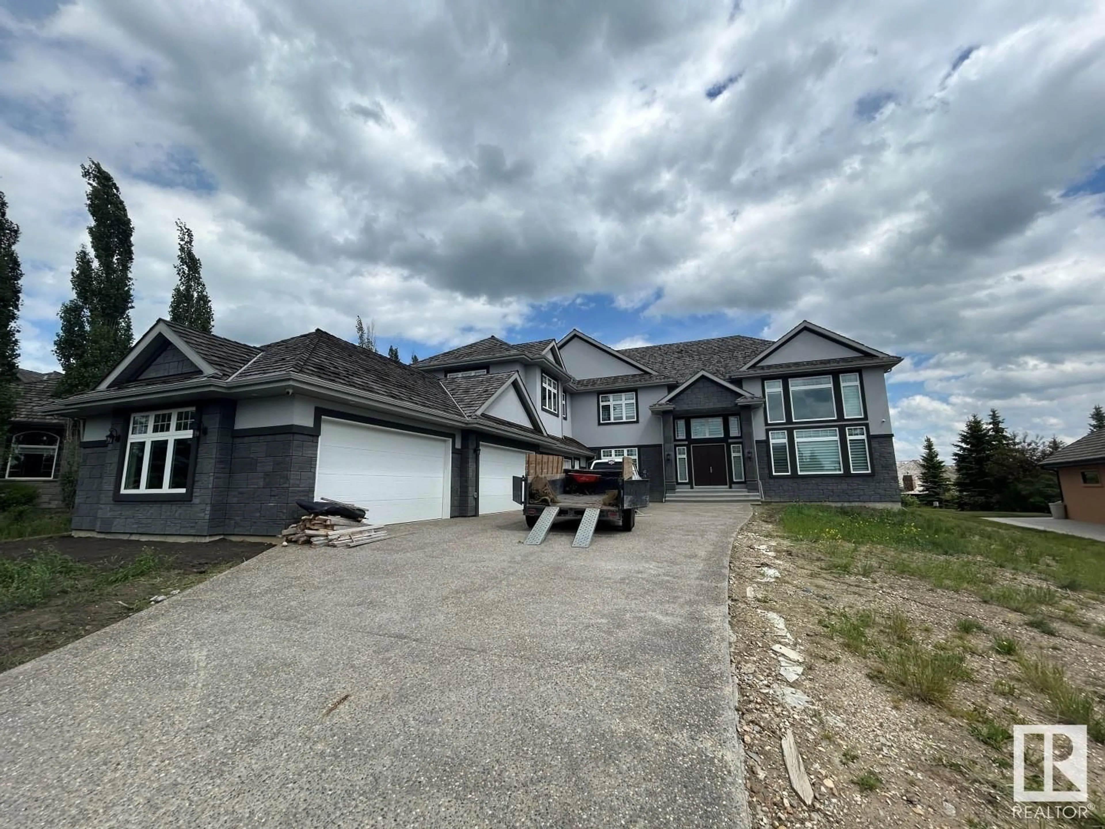 Frontside or backside of a home, the street view for 60 Riverstone CL, Rural Sturgeon County Alberta T8T0B9