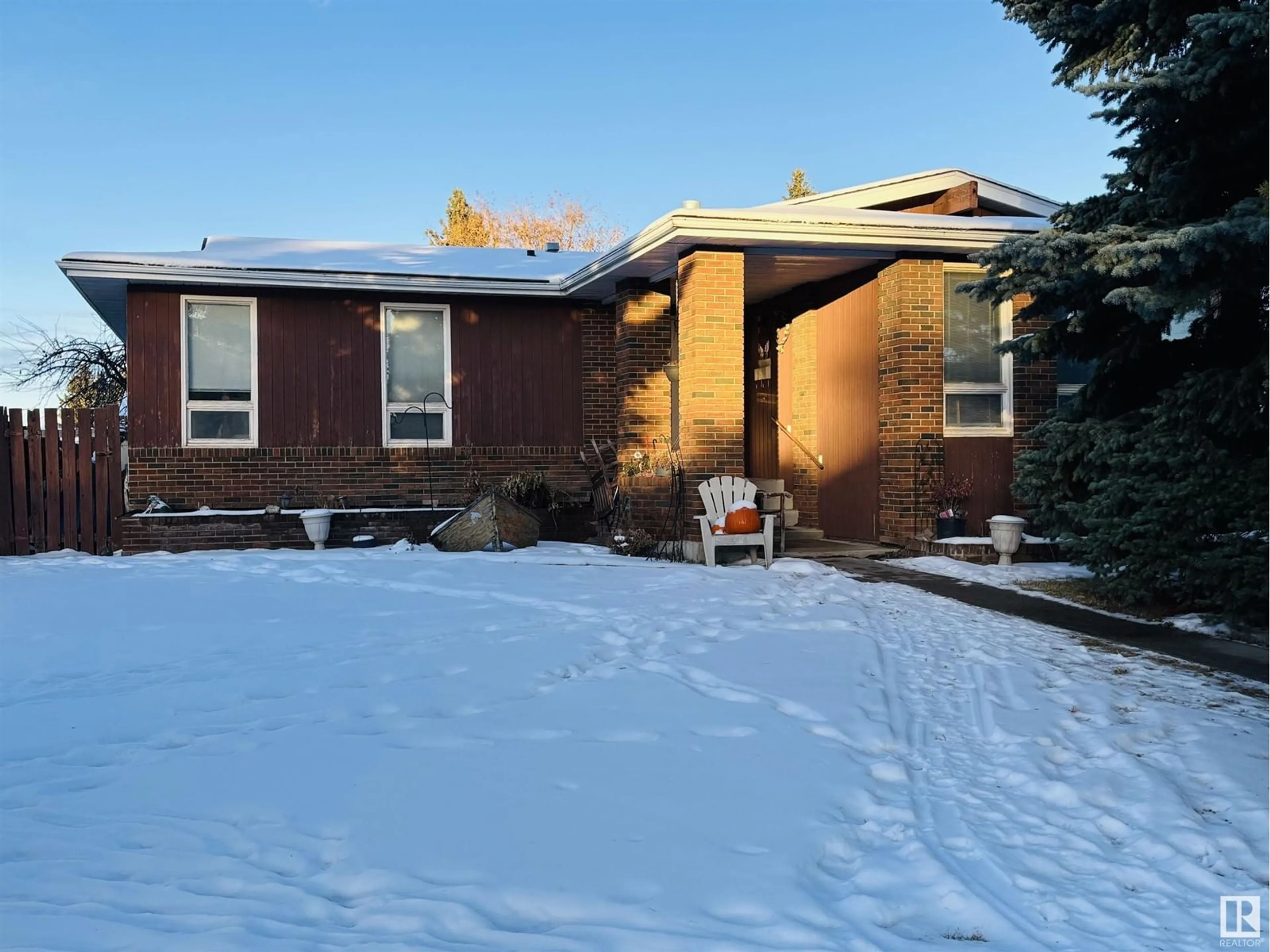 Frontside or backside of a home, the fenced backyard for 56 Oliver ST, Red Deer Alberta T4P1V6