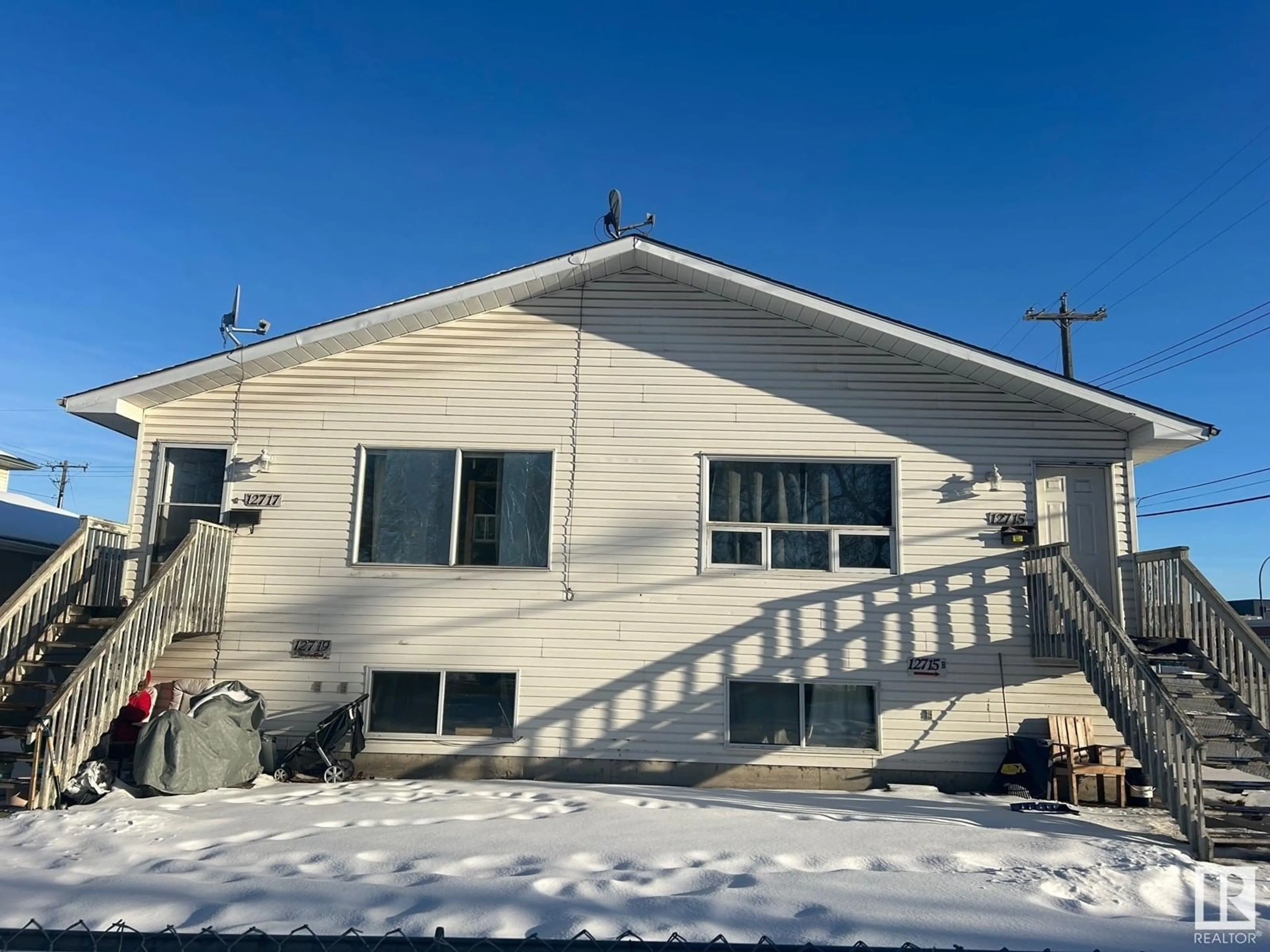 Frontside or backside of a home, the front or back of building for 12717 67 ST NW, Edmonton Alberta T5C0B9