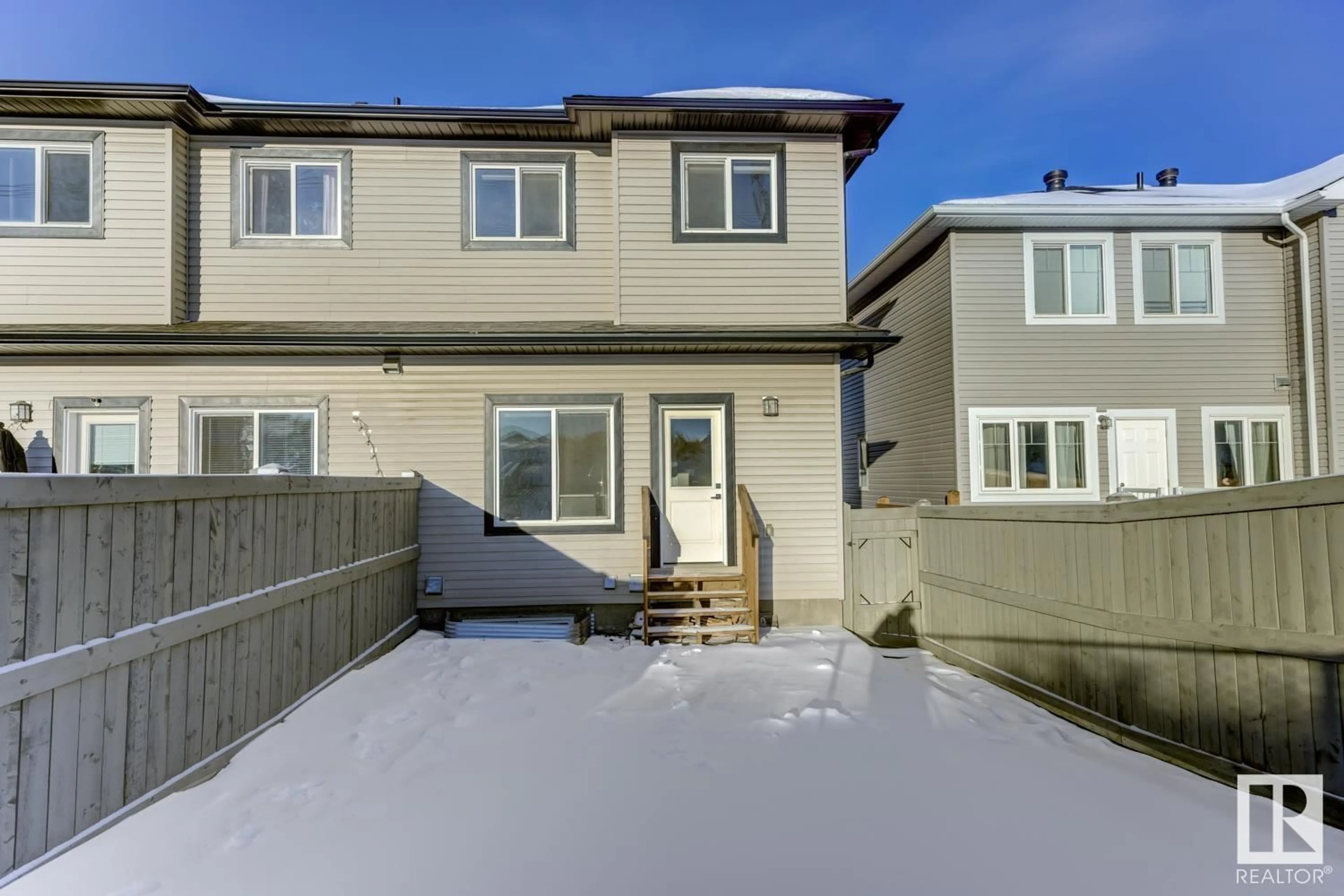 A pic from exterior of the house or condo, the fenced backyard for 8767 CARSON WY SW, Edmonton Alberta T6W4M3