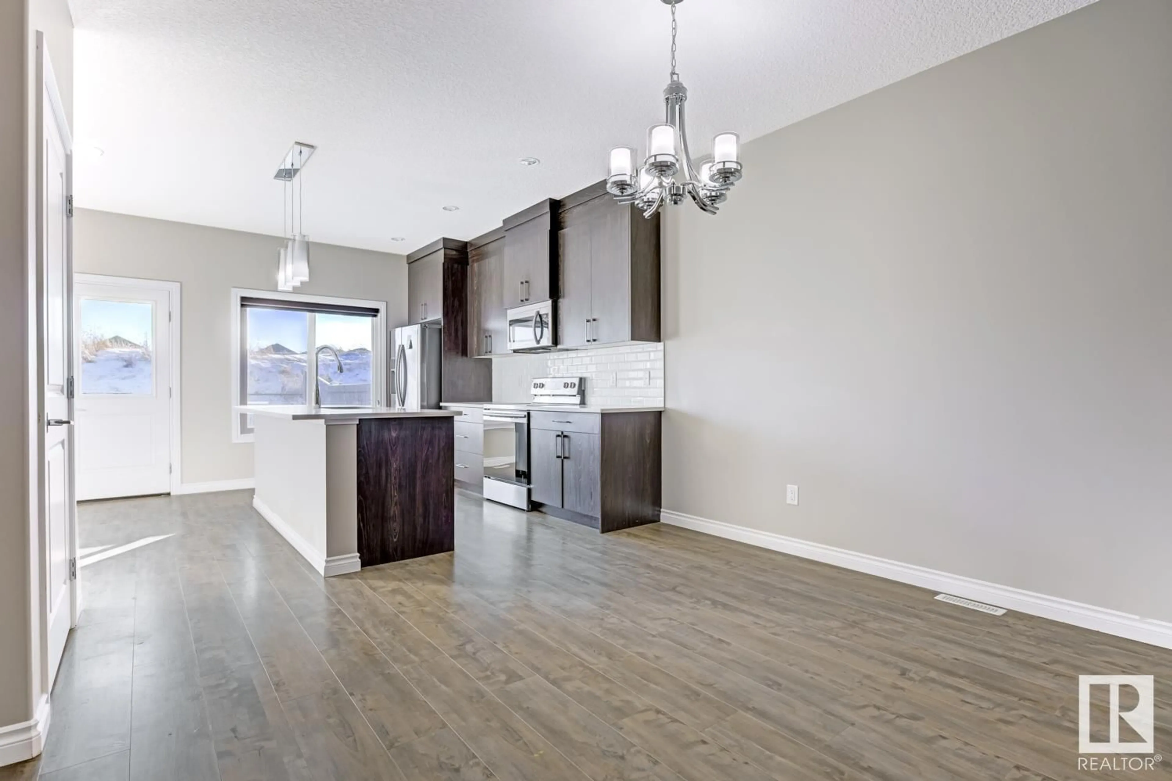 Open concept kitchen for 8767 CARSON WY SW, Edmonton Alberta T6W4M3