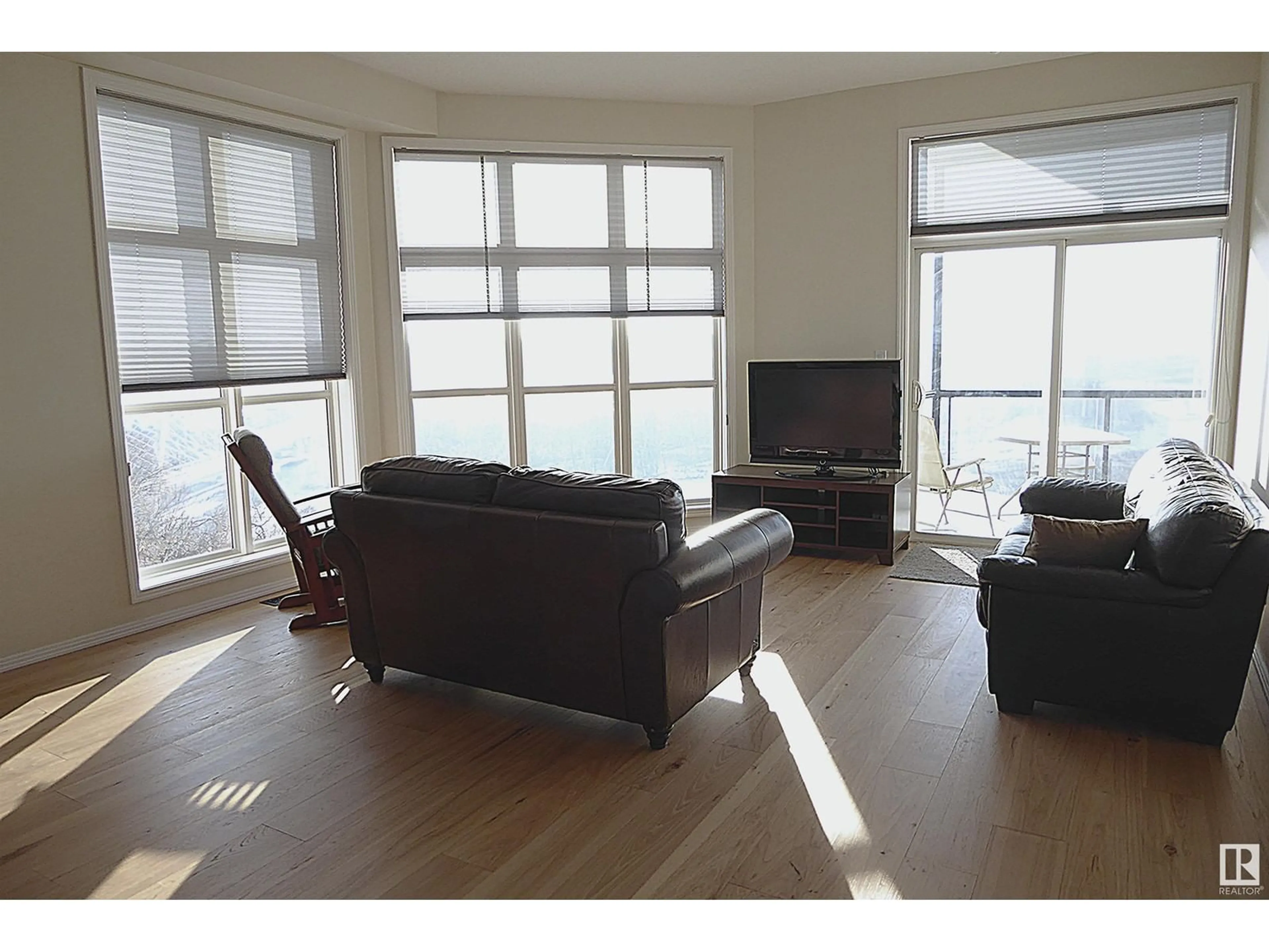 Living room, wood floors for #418 9507 101 AV NW NW, Edmonton Alberta T5H4R1