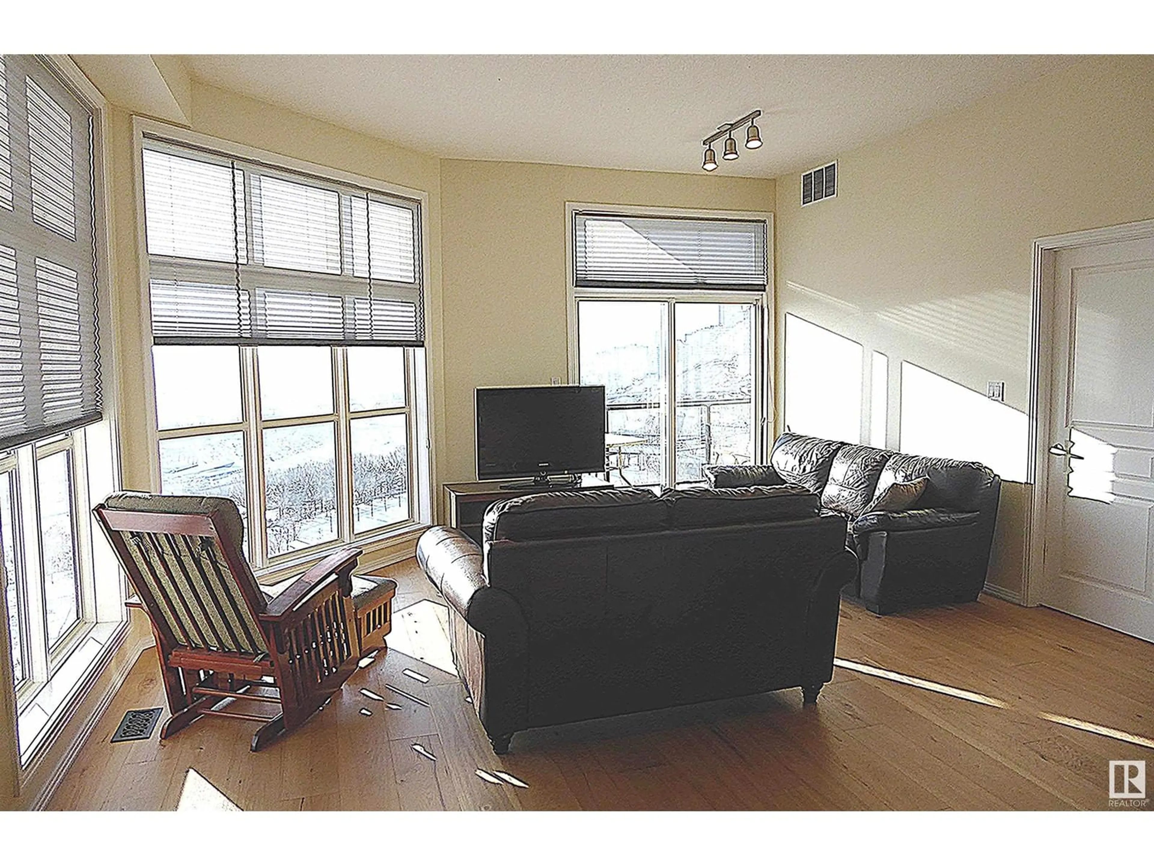 Living room, wood floors for #418 9507 101 AV NW NW, Edmonton Alberta T5H4R1