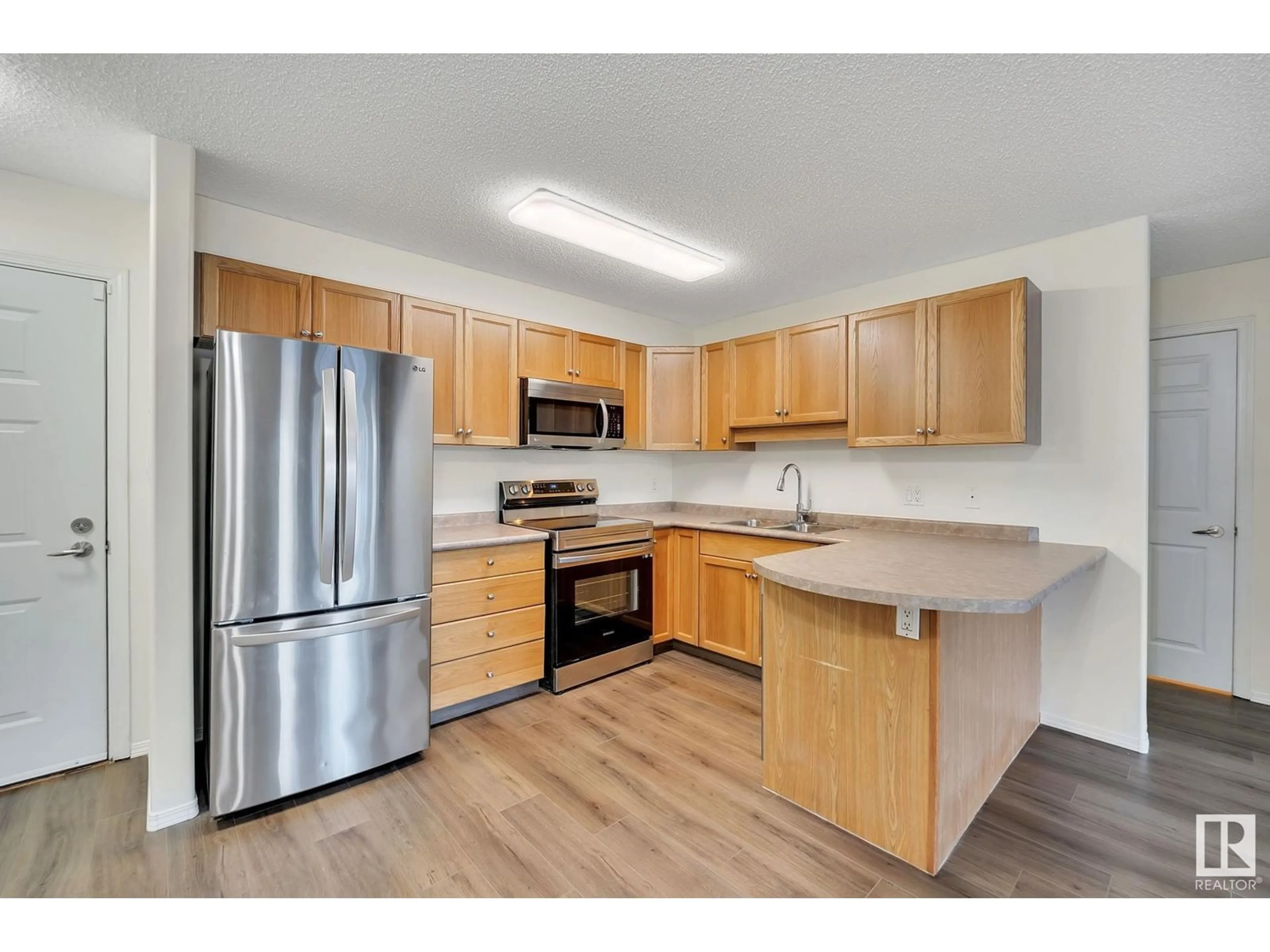 Standard kitchen, wood floors for #112 13635 34 ST NW, Edmonton Alberta T5A0C4