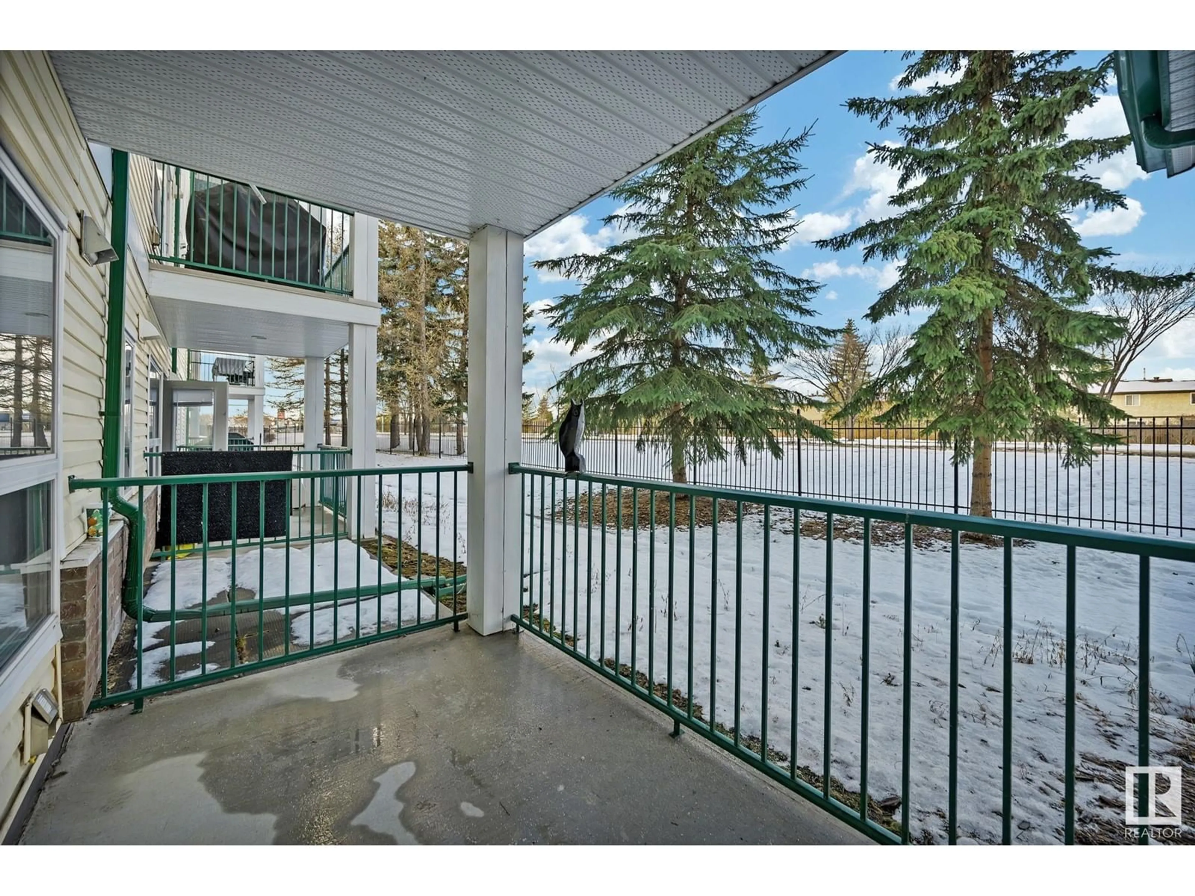 A pic from exterior of the house or condo, the fenced backyard for #112 13635 34 ST NW, Edmonton Alberta T5A0C4