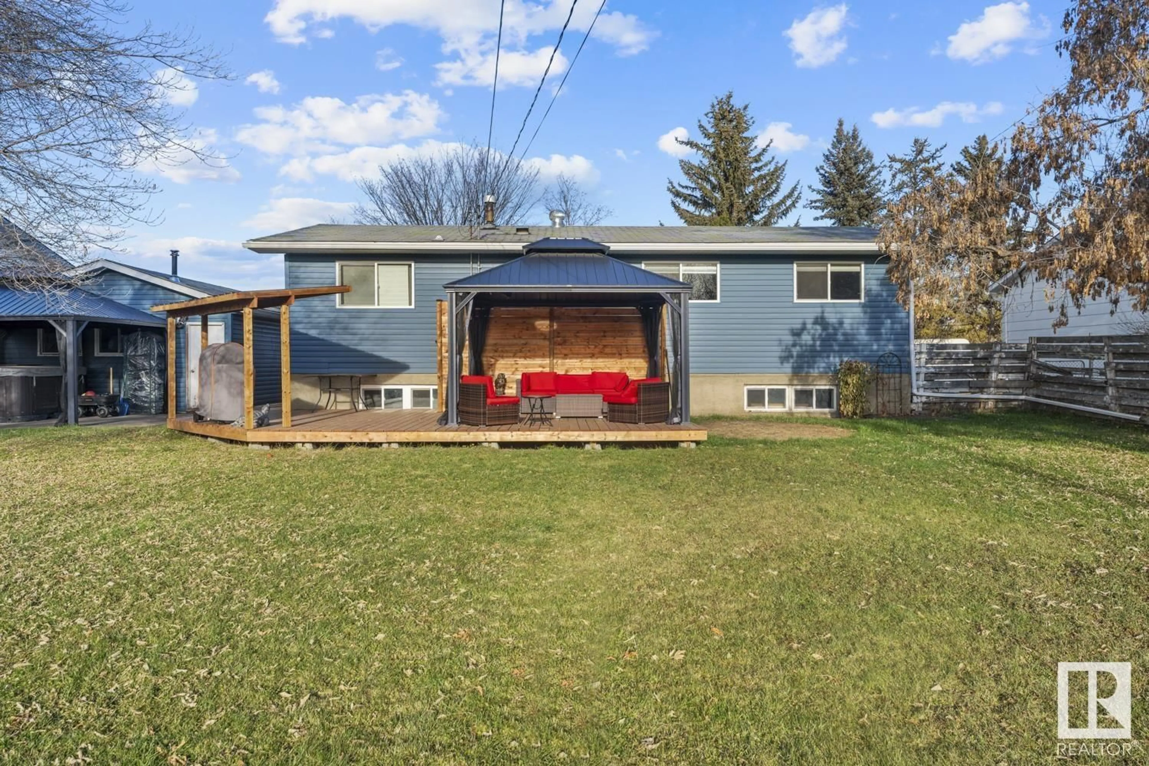 Frontside or backside of a home, the fenced backyard for 6009 52 AV, Cold Lake Alberta T9M2M3