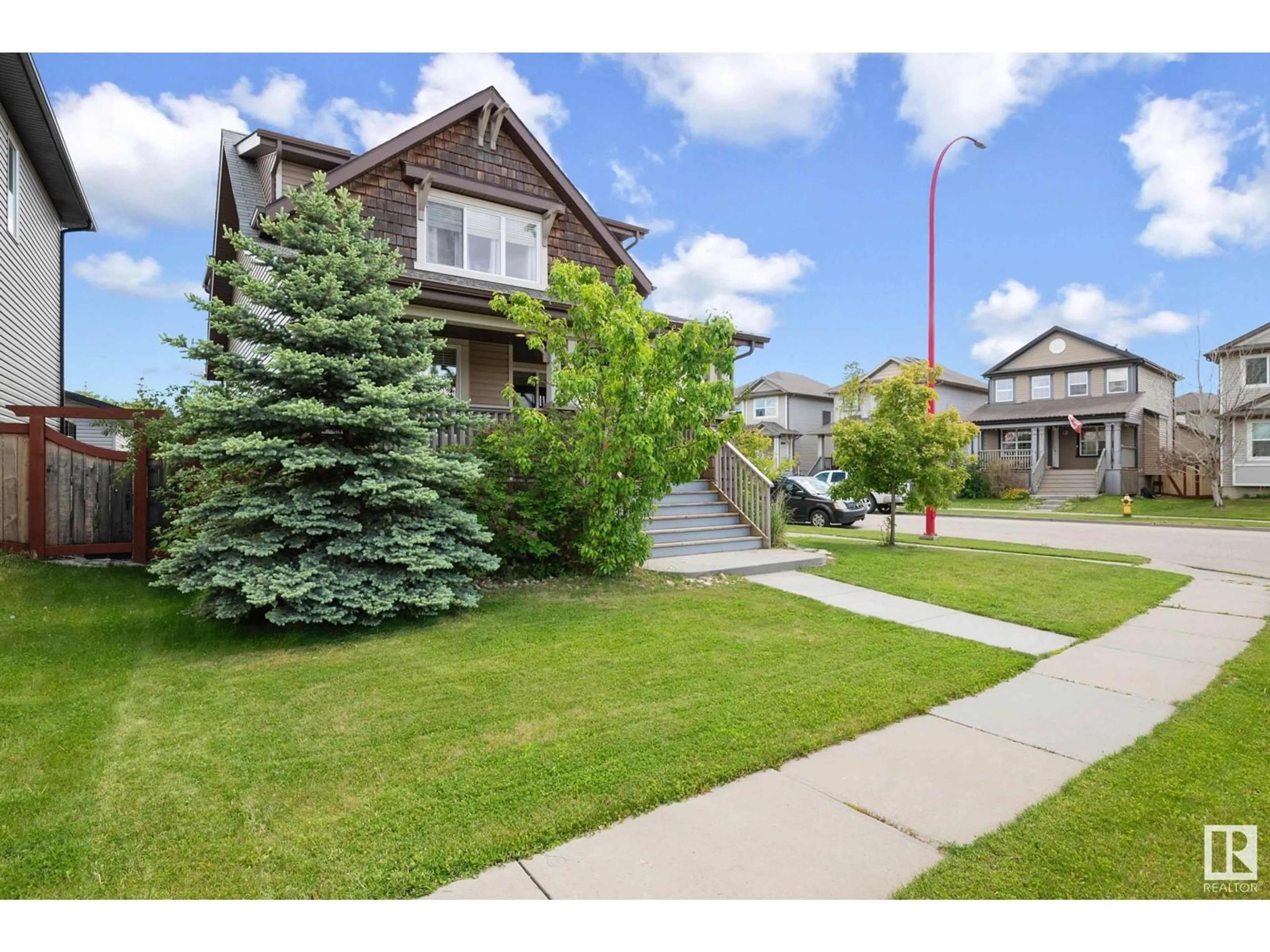 Frontside or backside of a home, the street view for 401 Songhurst PL, Leduc Alberta T9E0P7