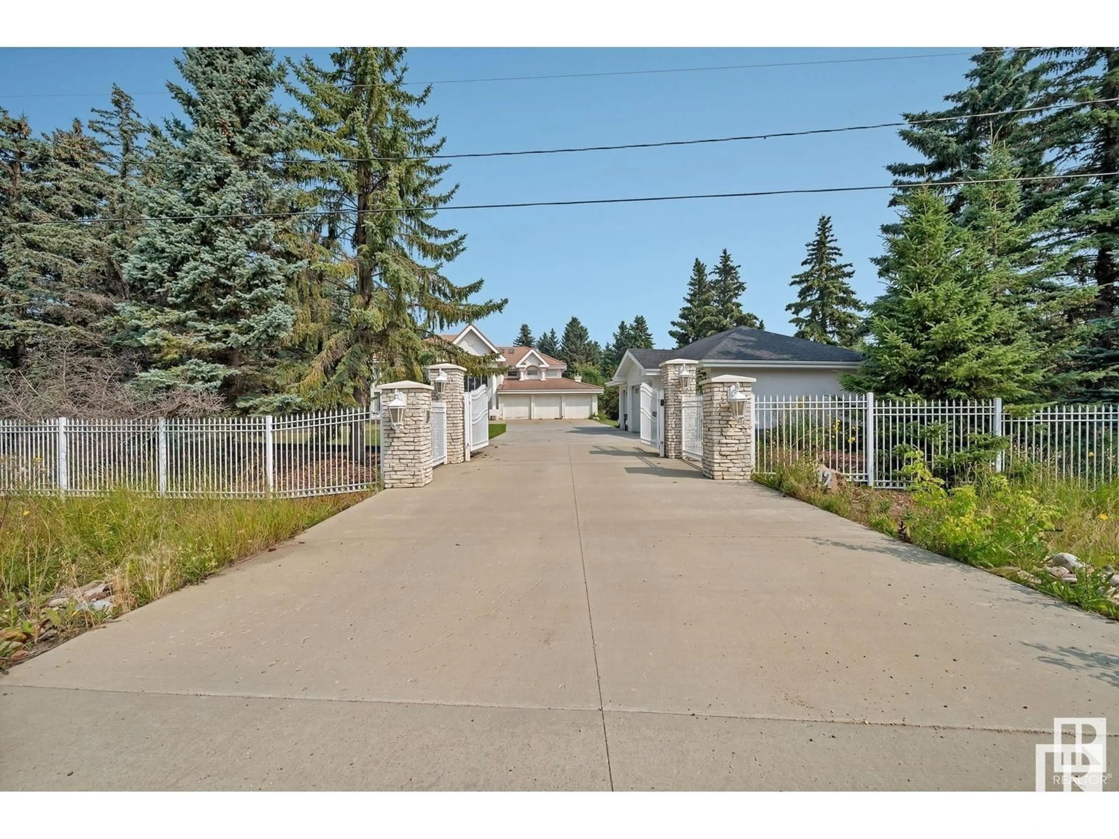 A pic from exterior of the house or condo, the fenced backyard for 10812 5 AV SW, Edmonton Alberta T6W1A2