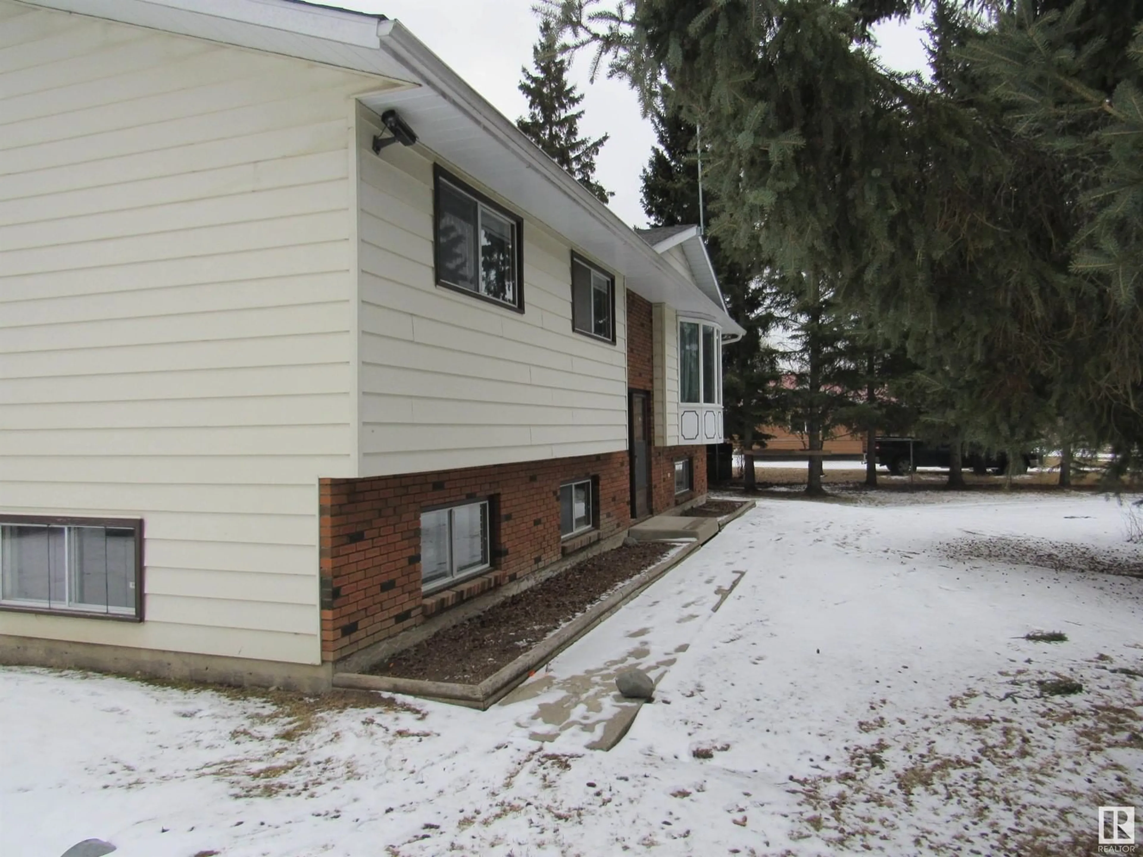 Frontside or backside of a home, the front or back of building for 303 57312 Range Road 25, Rural Barrhead County Alberta T0E1A0