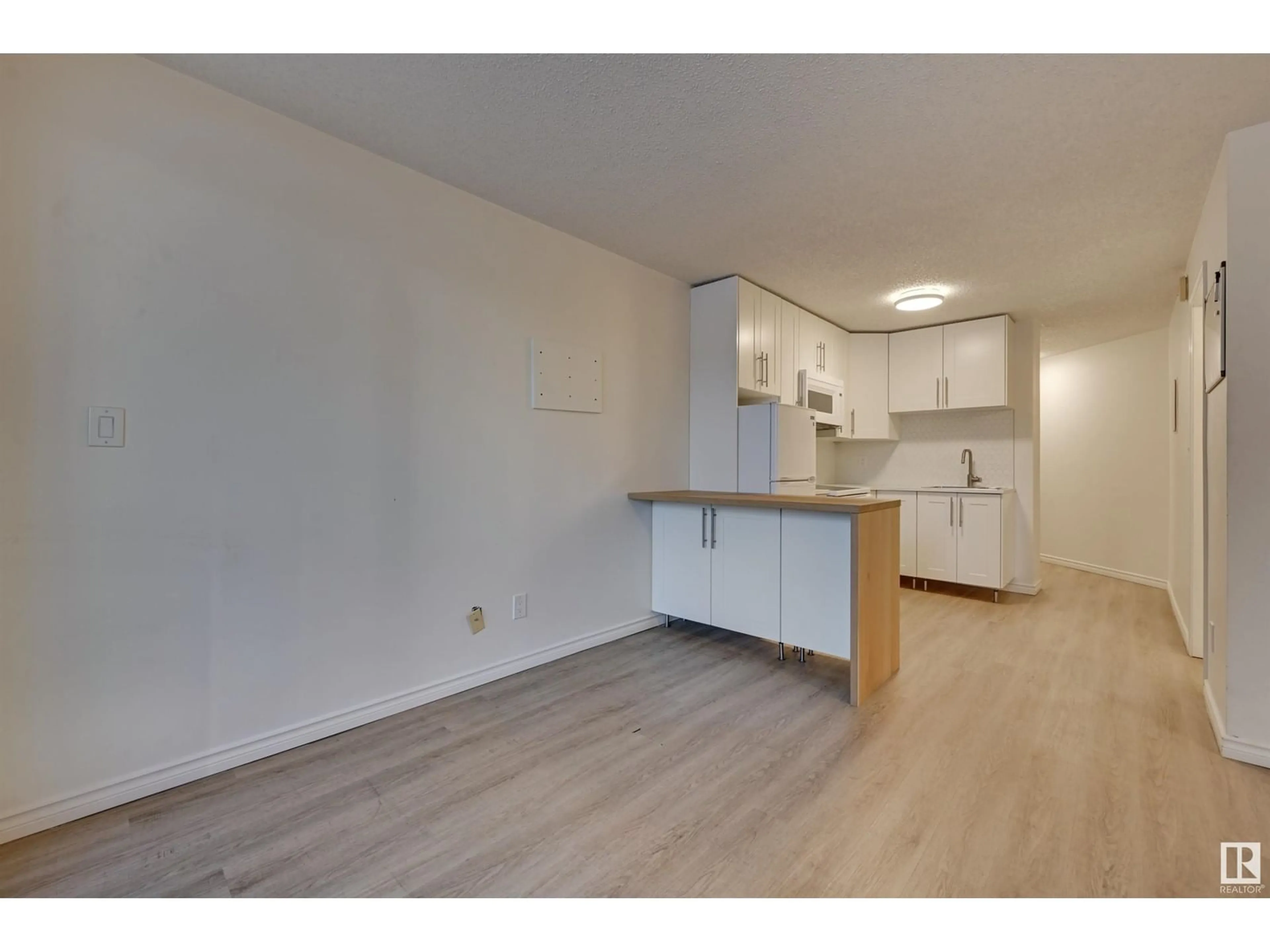 Standard kitchen, wood floors for #203 11503 100 AV NW, Edmonton Alberta T5K2K7