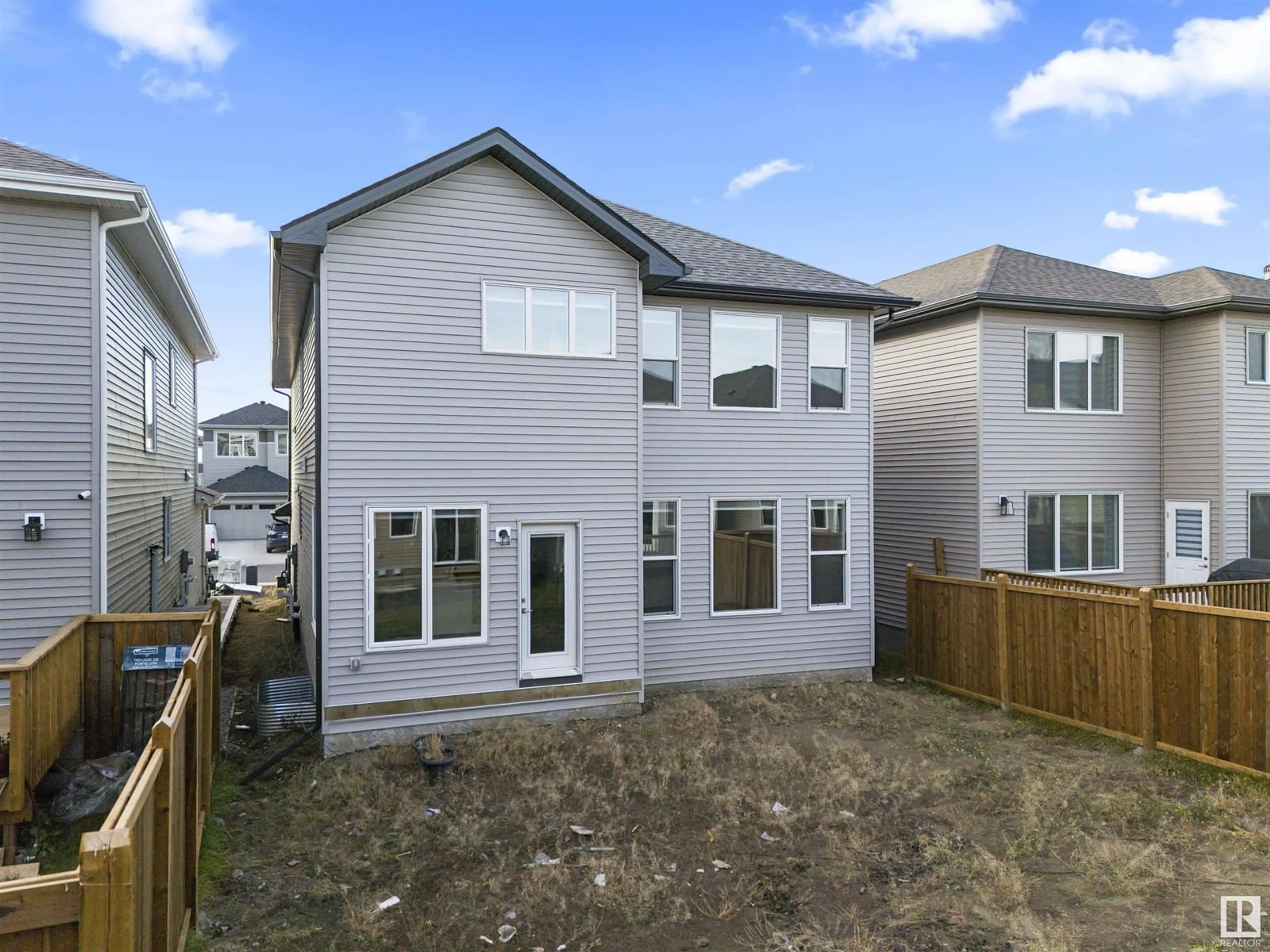 Frontside or backside of a home, the fenced backyard for 1635 16 st NW, Edmonton Alberta T6X2J2