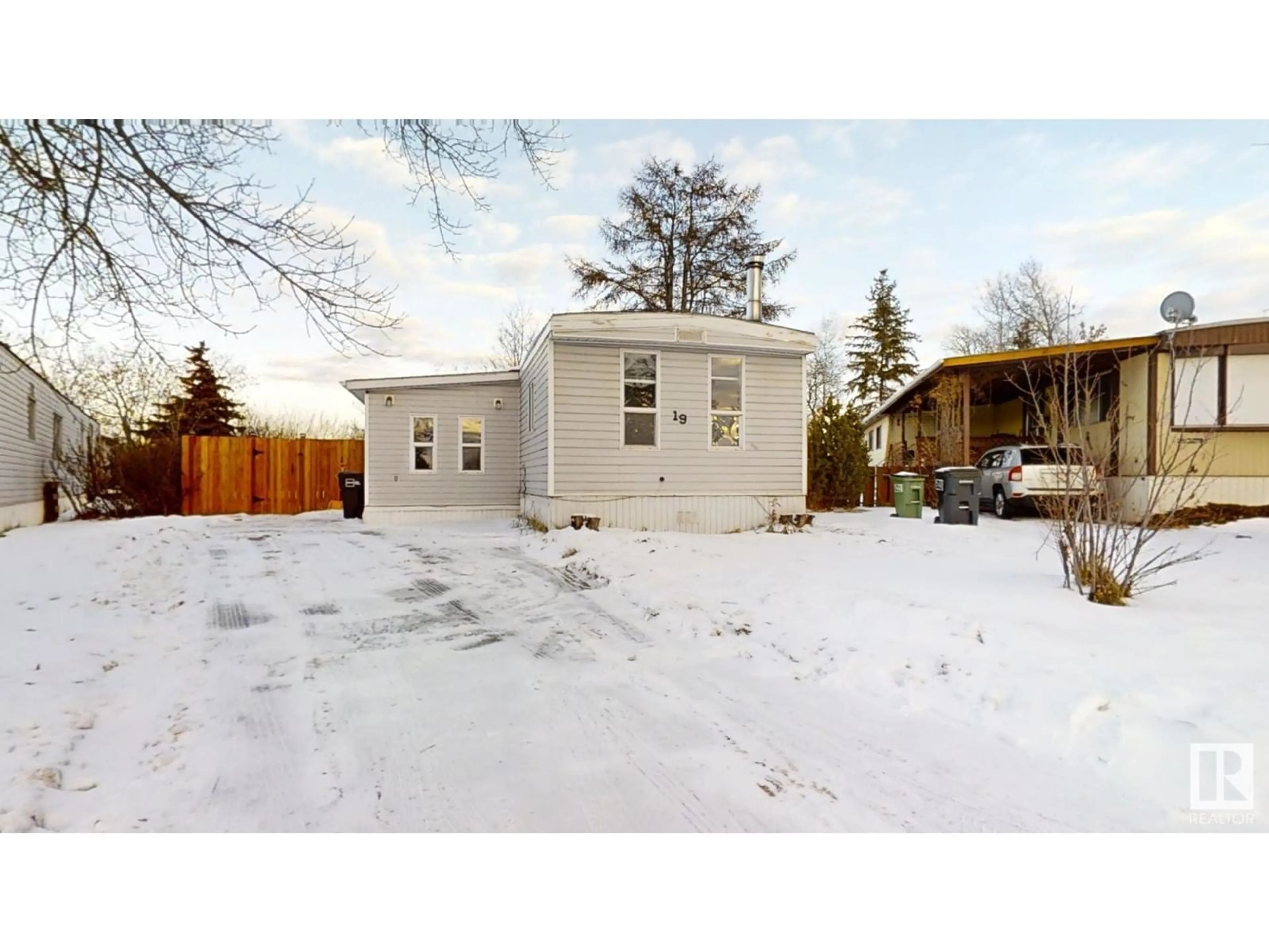 Frontside or backside of a home, the fenced backyard for 19 Quarry CR NW, Edmonton Alberta T6P1B8