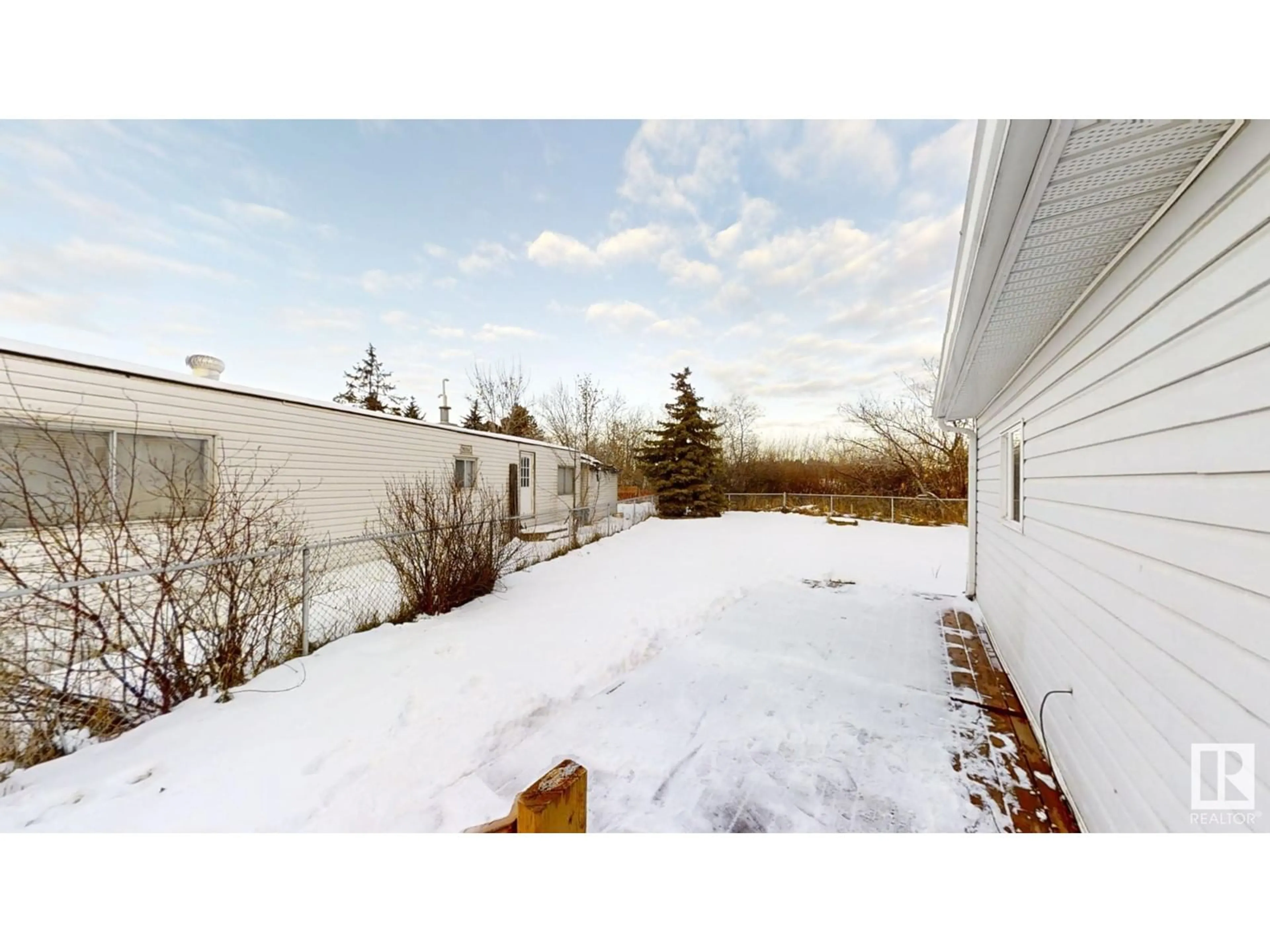 A pic from exterior of the house or condo, the fenced backyard for 19 Quarry CR NW, Edmonton Alberta T6P1B8