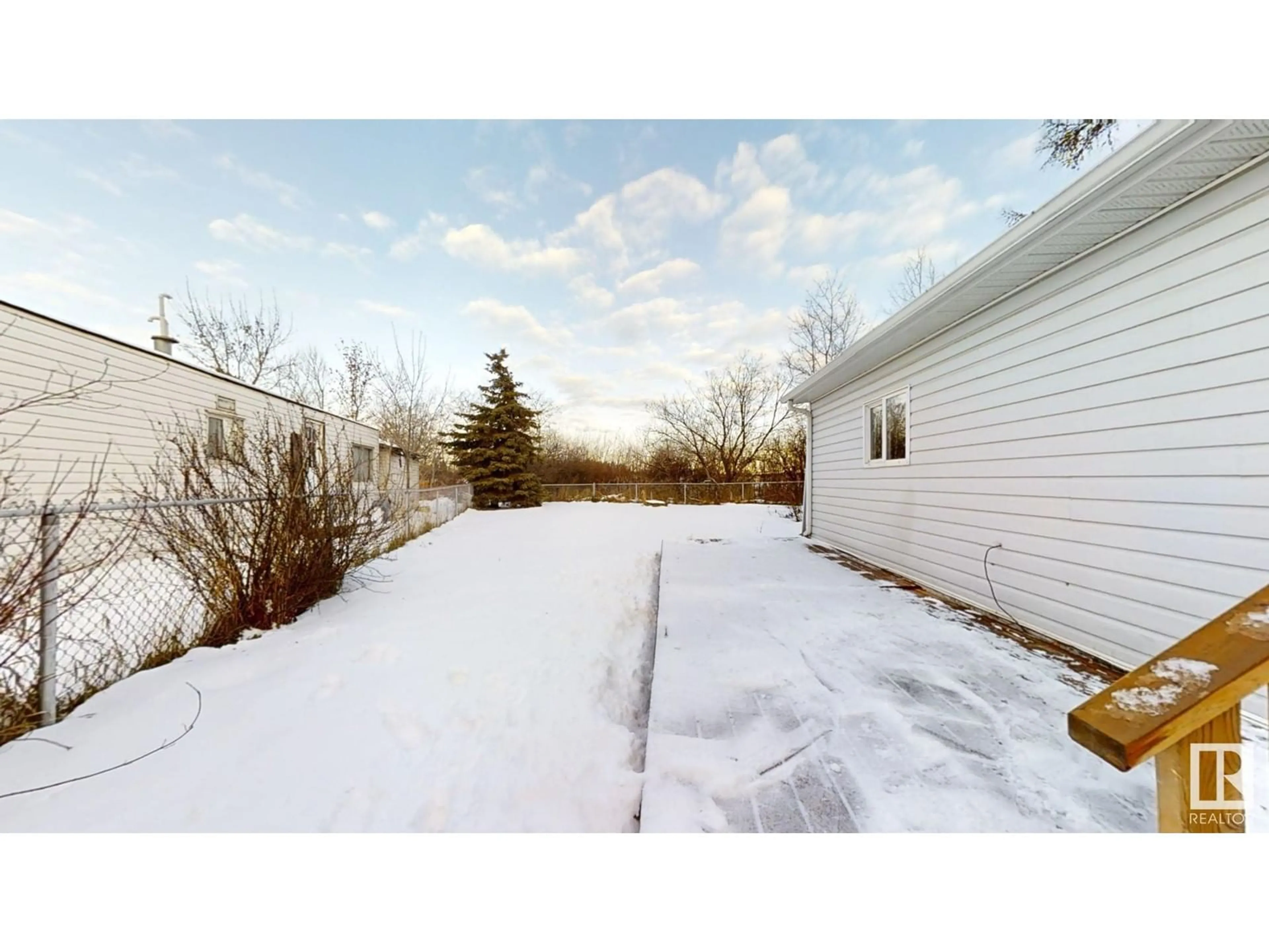 A pic from exterior of the house or condo, the fenced backyard for 19 Quarry CR NW, Edmonton Alberta T6P1B8