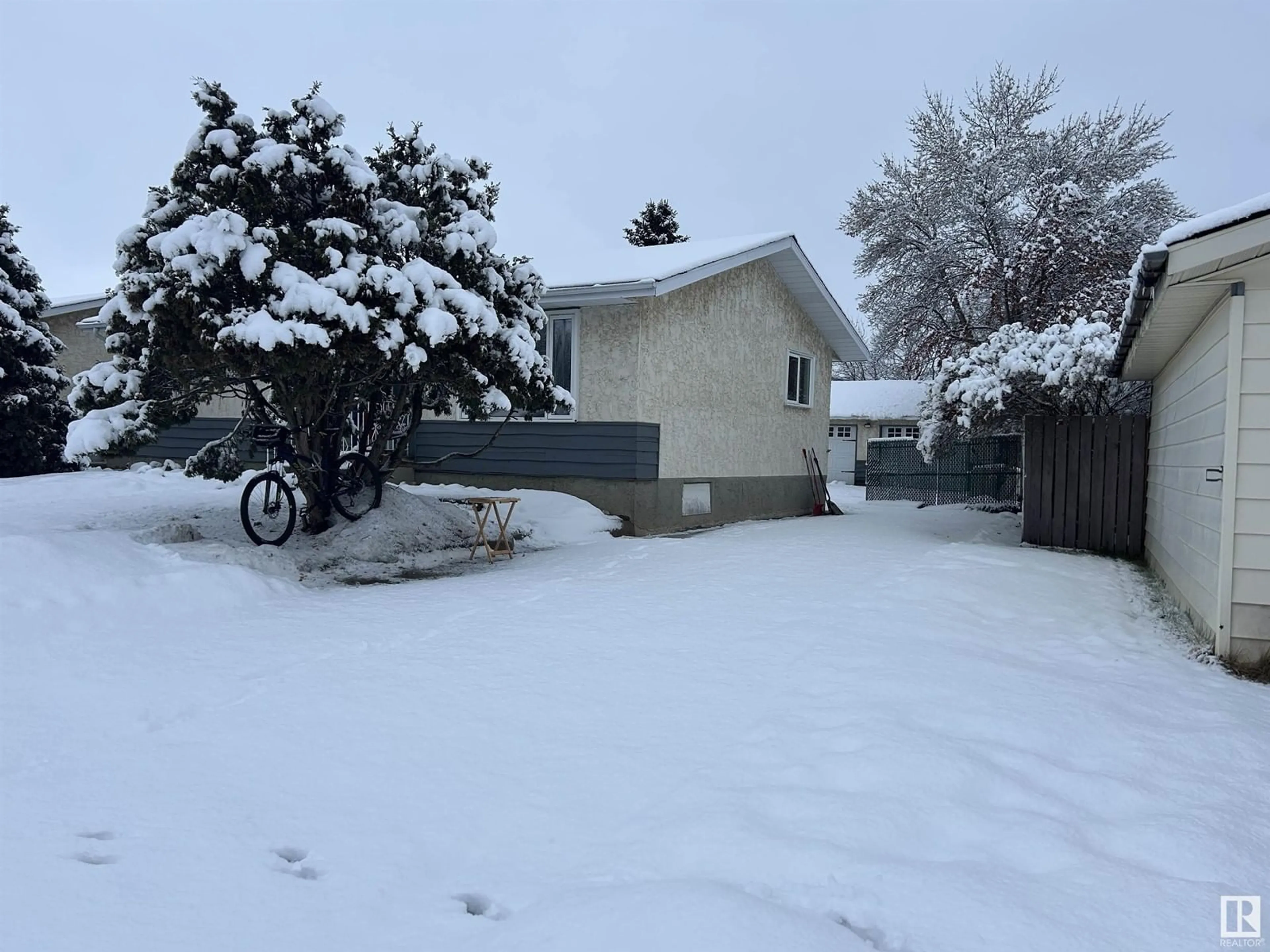 Frontside or backside of a home, the fenced backyard for 5903 53 AV, Redwater Alberta T0A2W0