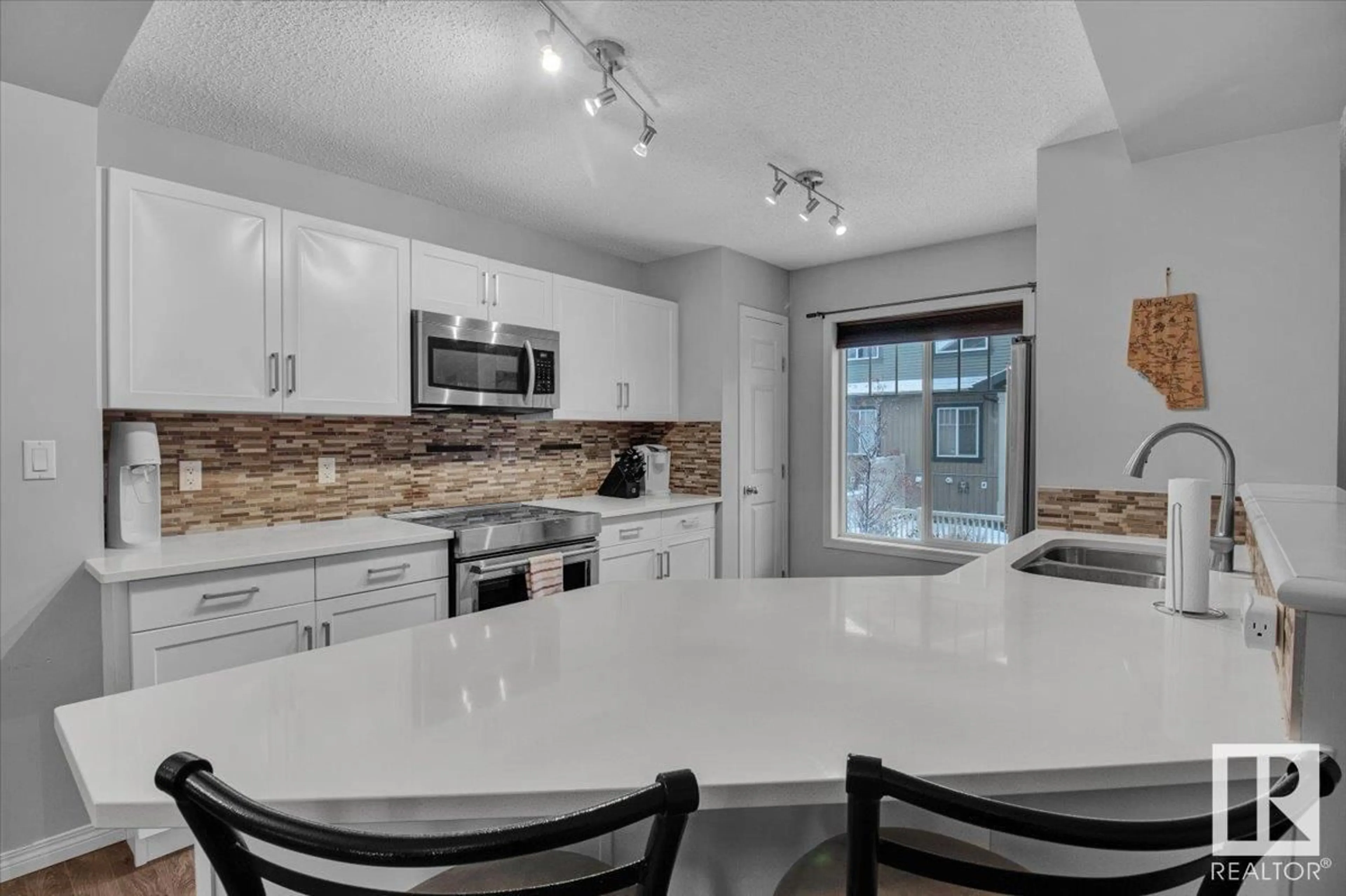 Open concept kitchen for #91 3305 ORCHARDS LINK LI SW, Edmonton Alberta T6X2H1