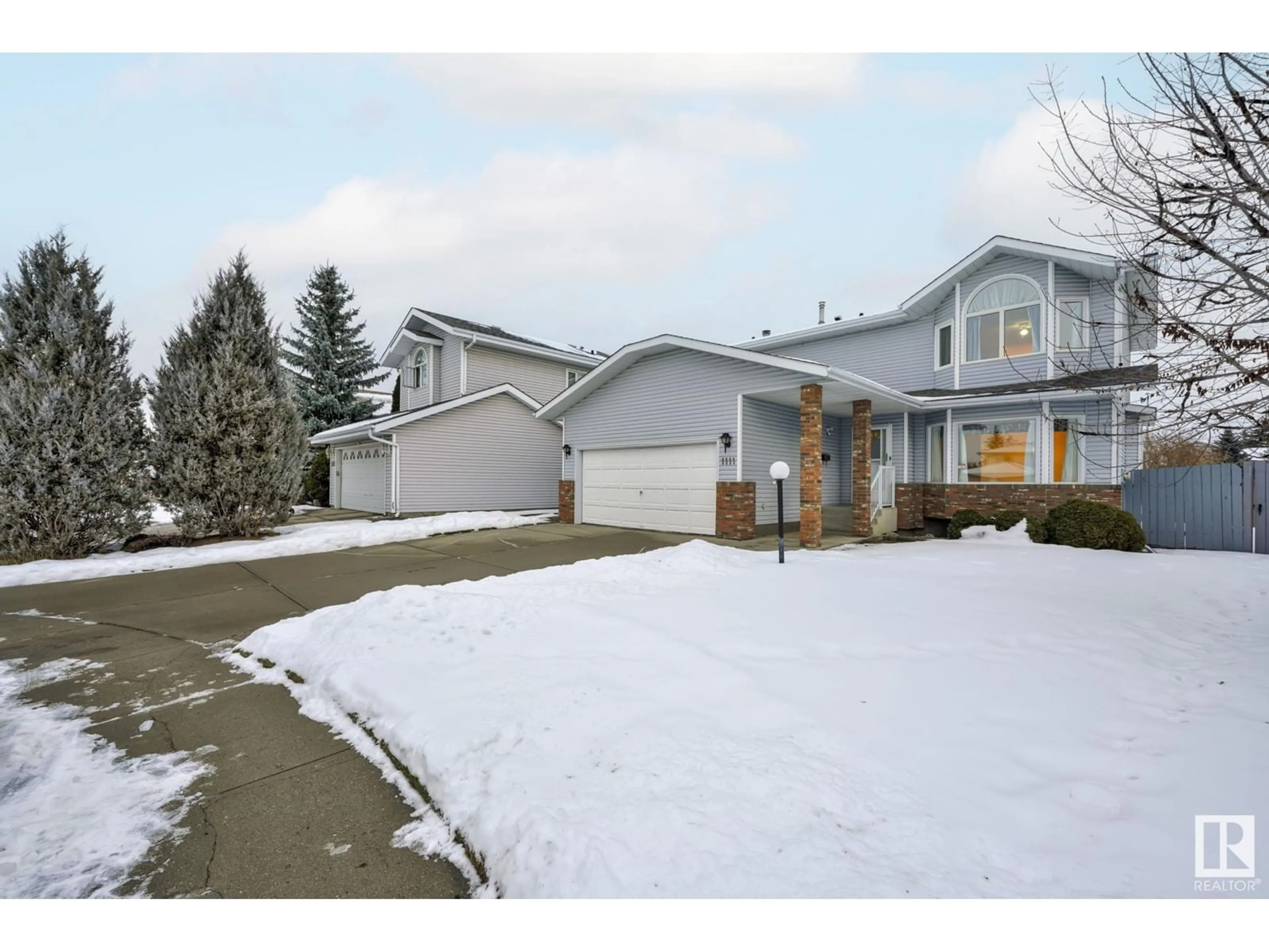 Frontside or backside of a home, the fenced backyard for 1111 111A ST NW, Edmonton Alberta T6J6R9