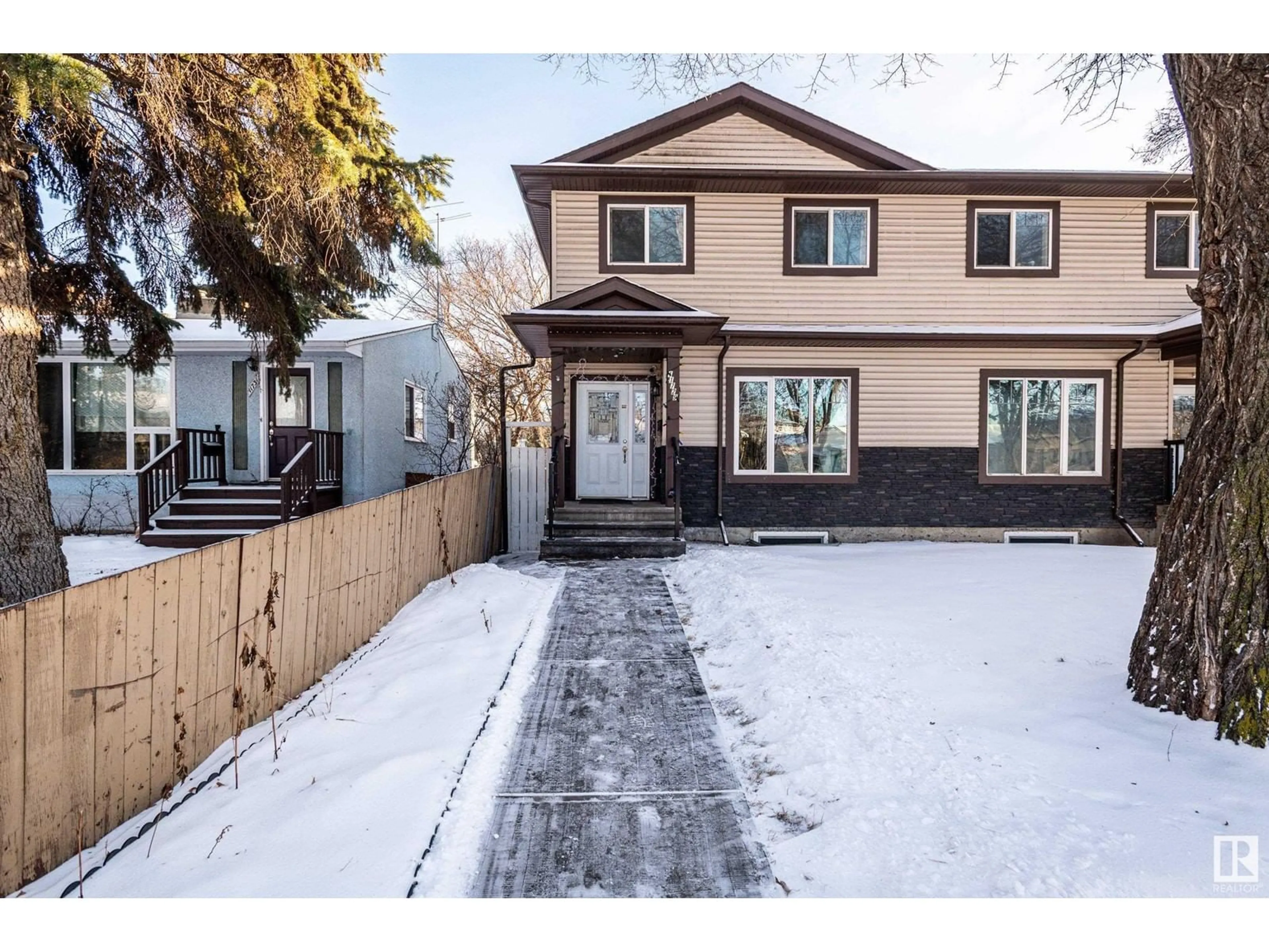 Frontside or backside of a home, the fenced backyard for 11729 125 ST NW, Edmonton Alberta T5M0N7