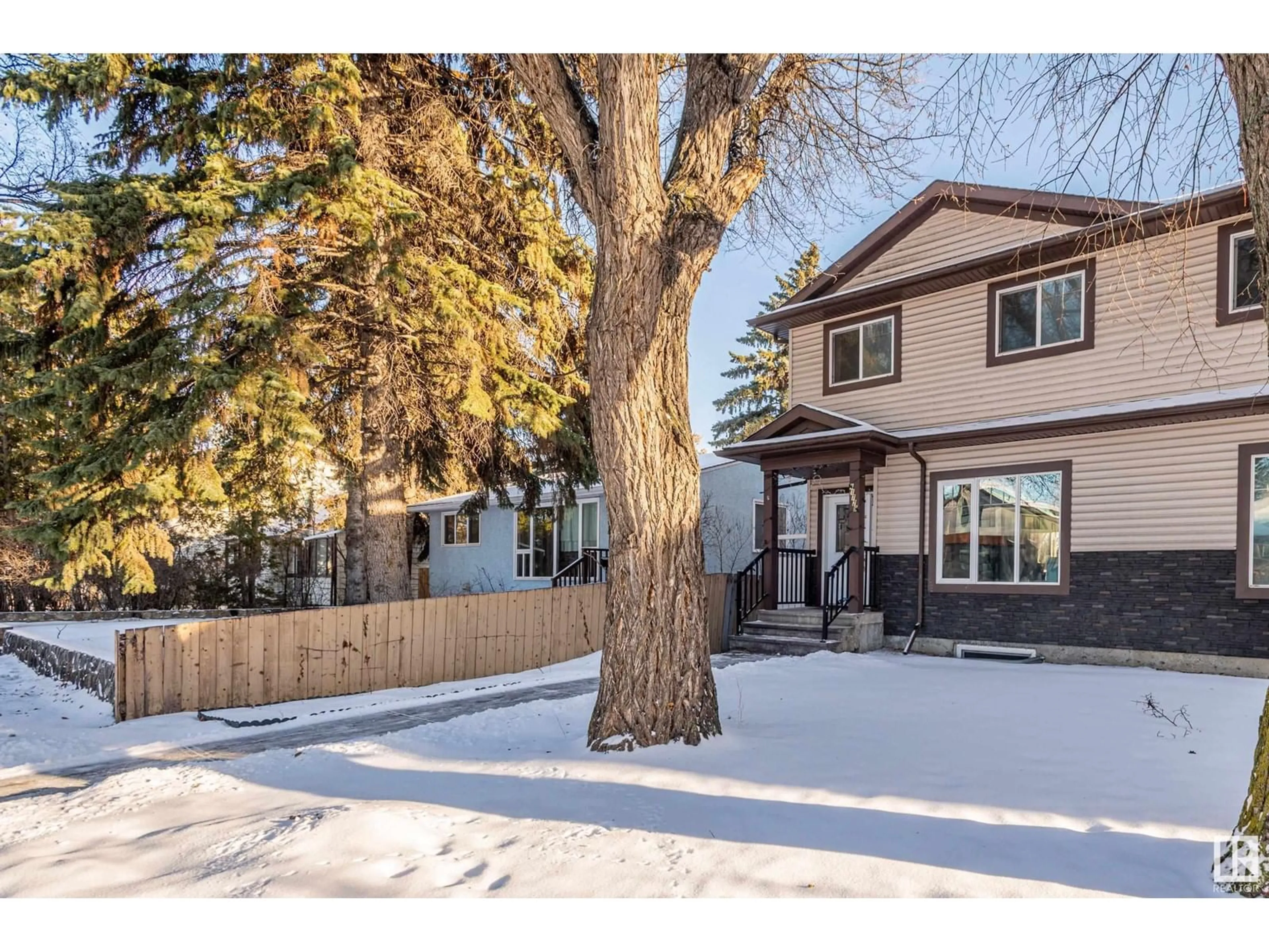 Frontside or backside of a home, the fenced backyard for 11729 125 ST NW, Edmonton Alberta T5M0N7