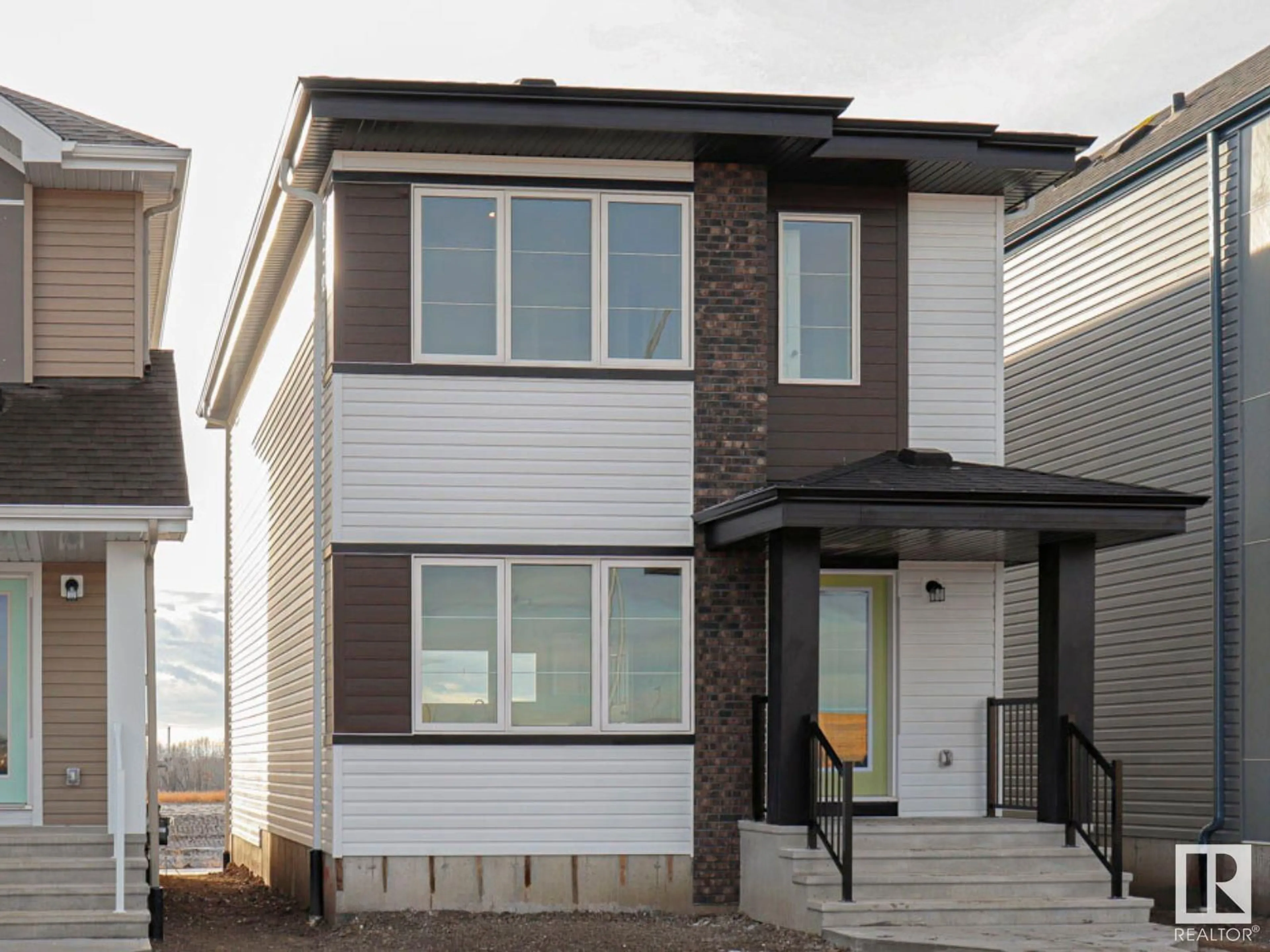 Home with vinyl exterior material, street for 648 174 AV NE, Edmonton Alberta T5Y6G4