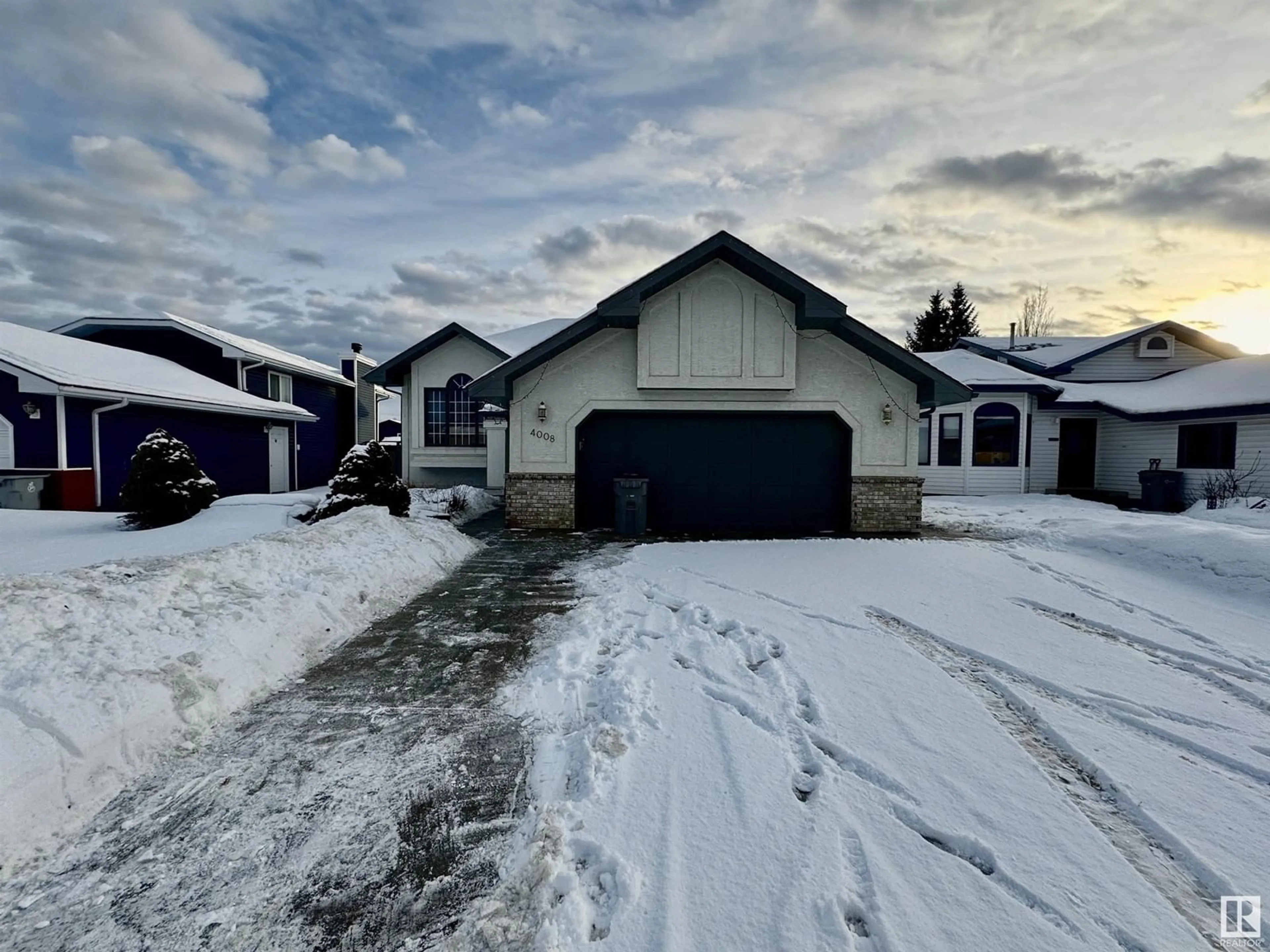 A pic from outside/outdoor area/front of a property/back of a property/a pic from drone, street for 4008 55 AV, Whitecourt Alberta T7S1C5