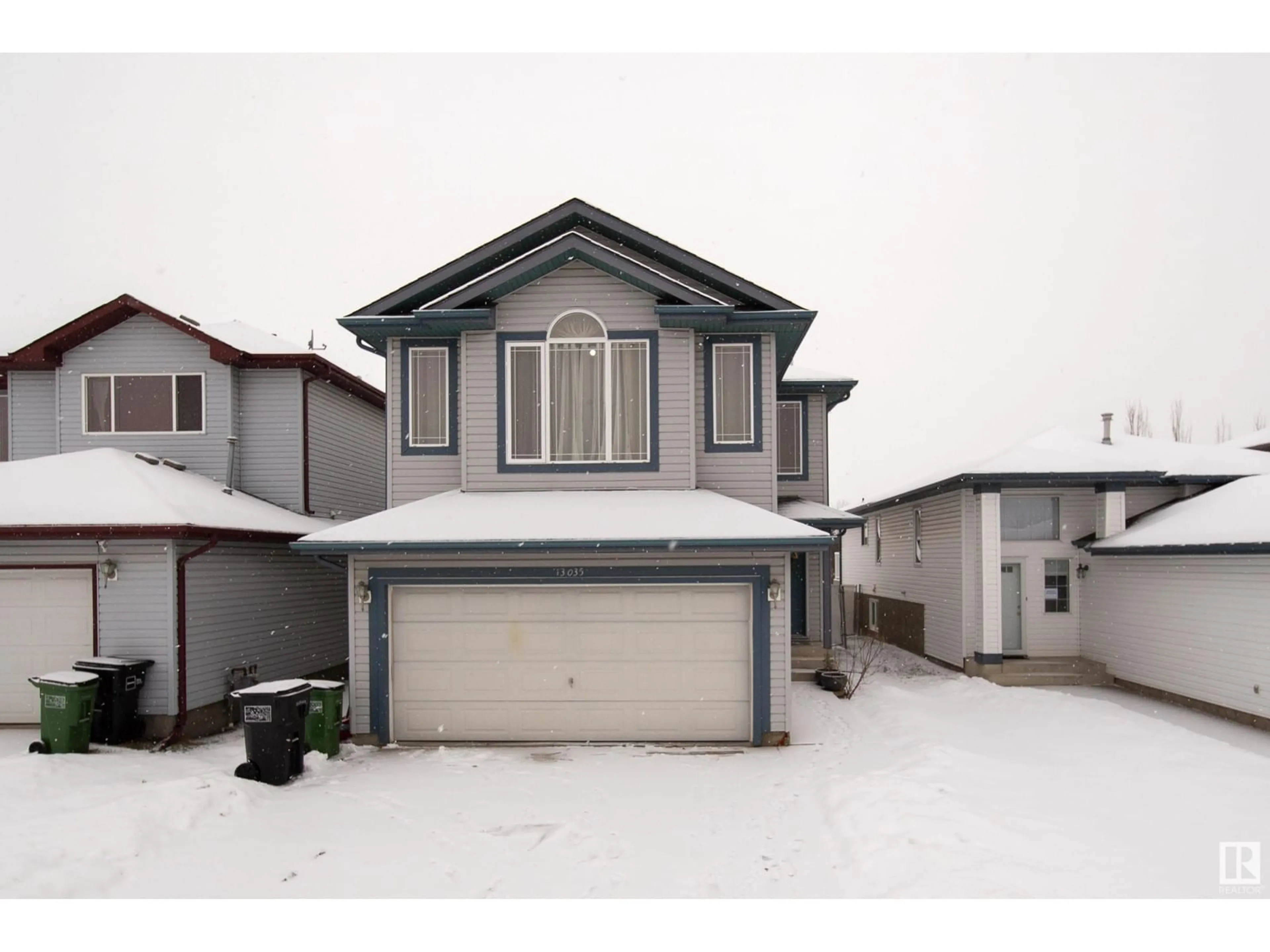 Home with vinyl exterior material, street for 13035 35 ST NW, Edmonton Alberta T5A5C8