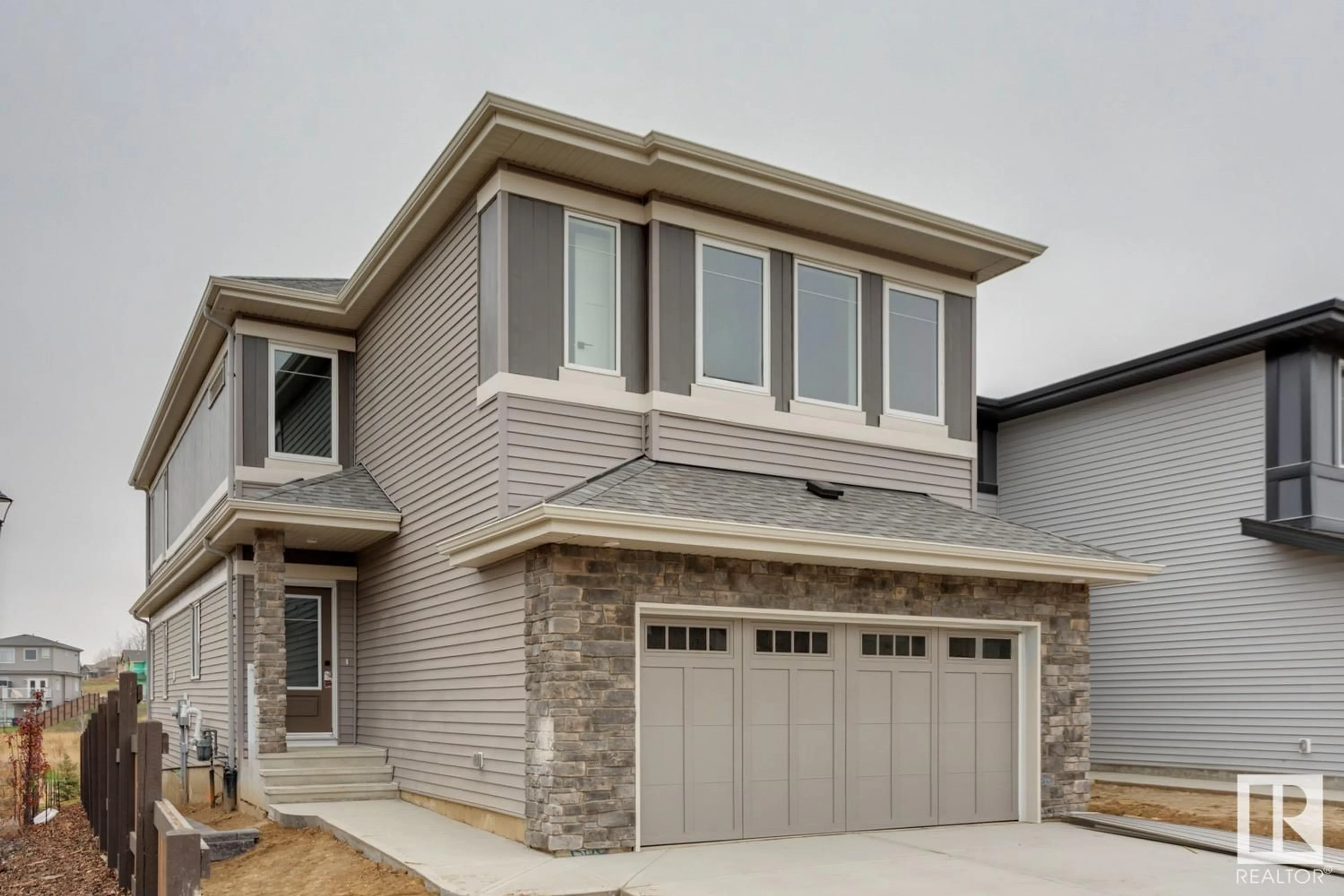 Home with brick exterior material, street for 668 Kinglet BV NW, Edmonton Alberta T5S0S8