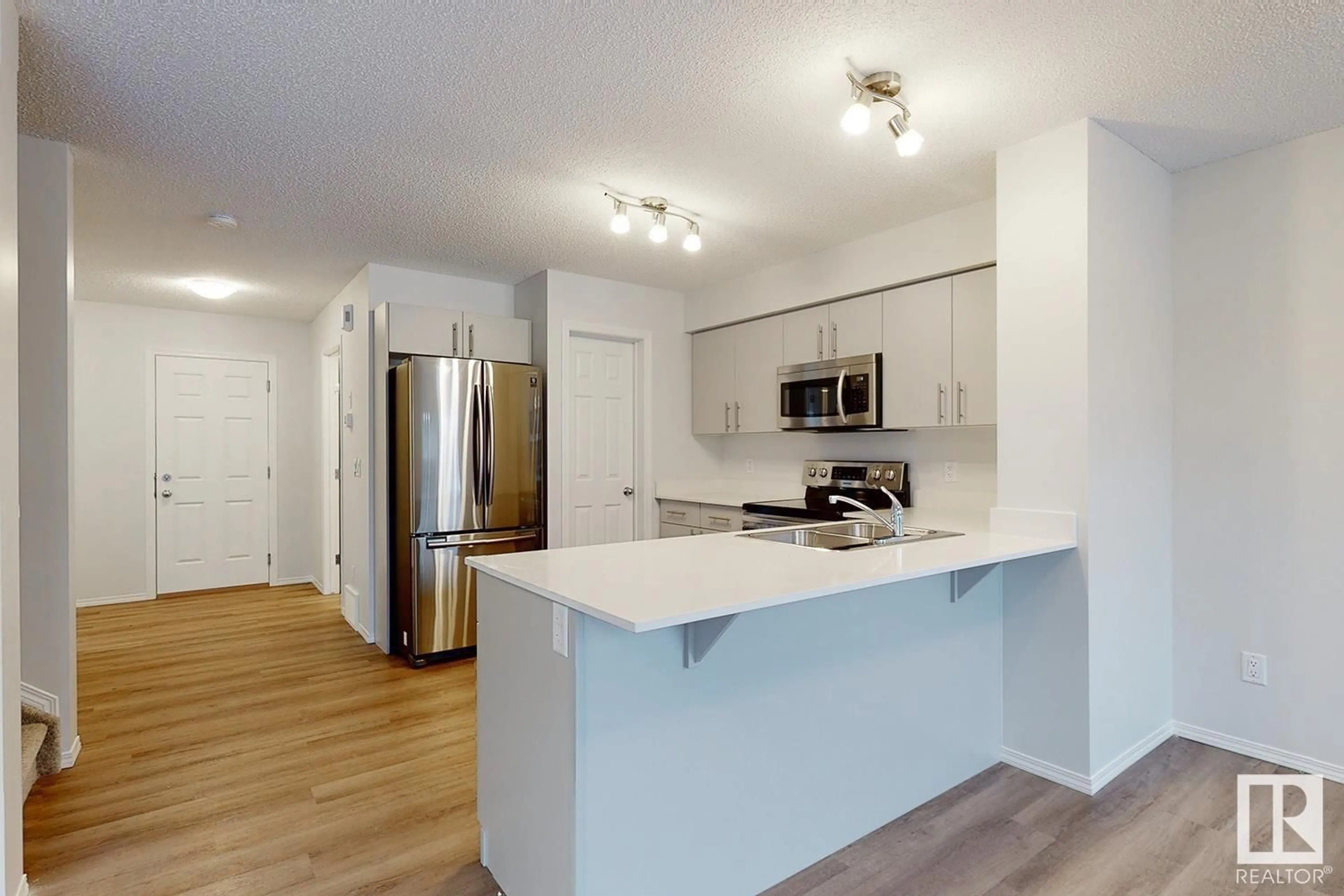 Open concept kitchen, wood/laminate floor for 1733 WESTERRA WD, Stony Plain Alberta T7Z0K8