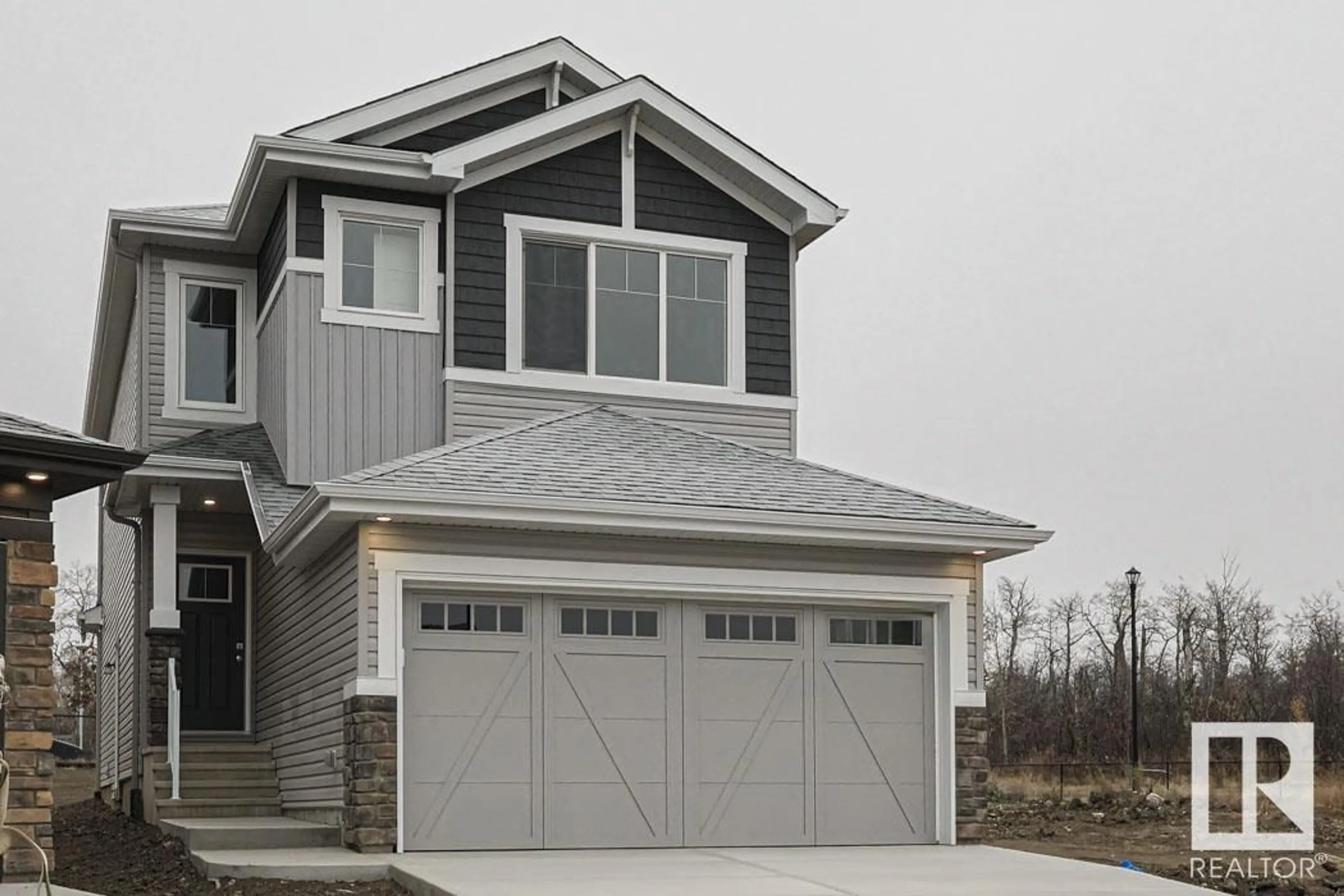 Home with vinyl exterior material, street for 17505 62A ST NW, Edmonton Alberta T5Y3P2