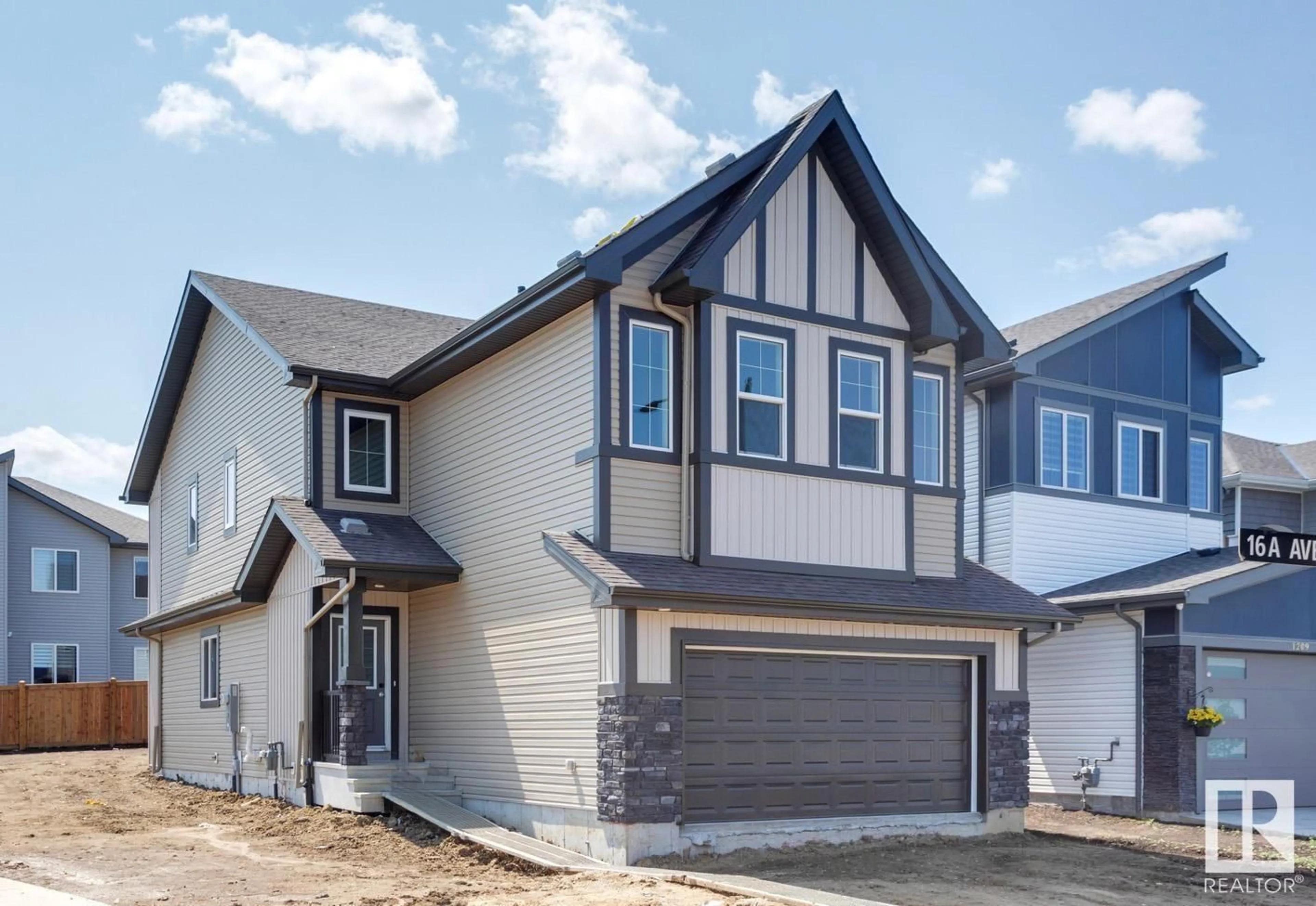 Home with vinyl exterior material, street for 1205 16A AV, Edmonton Alberta T6T2V1