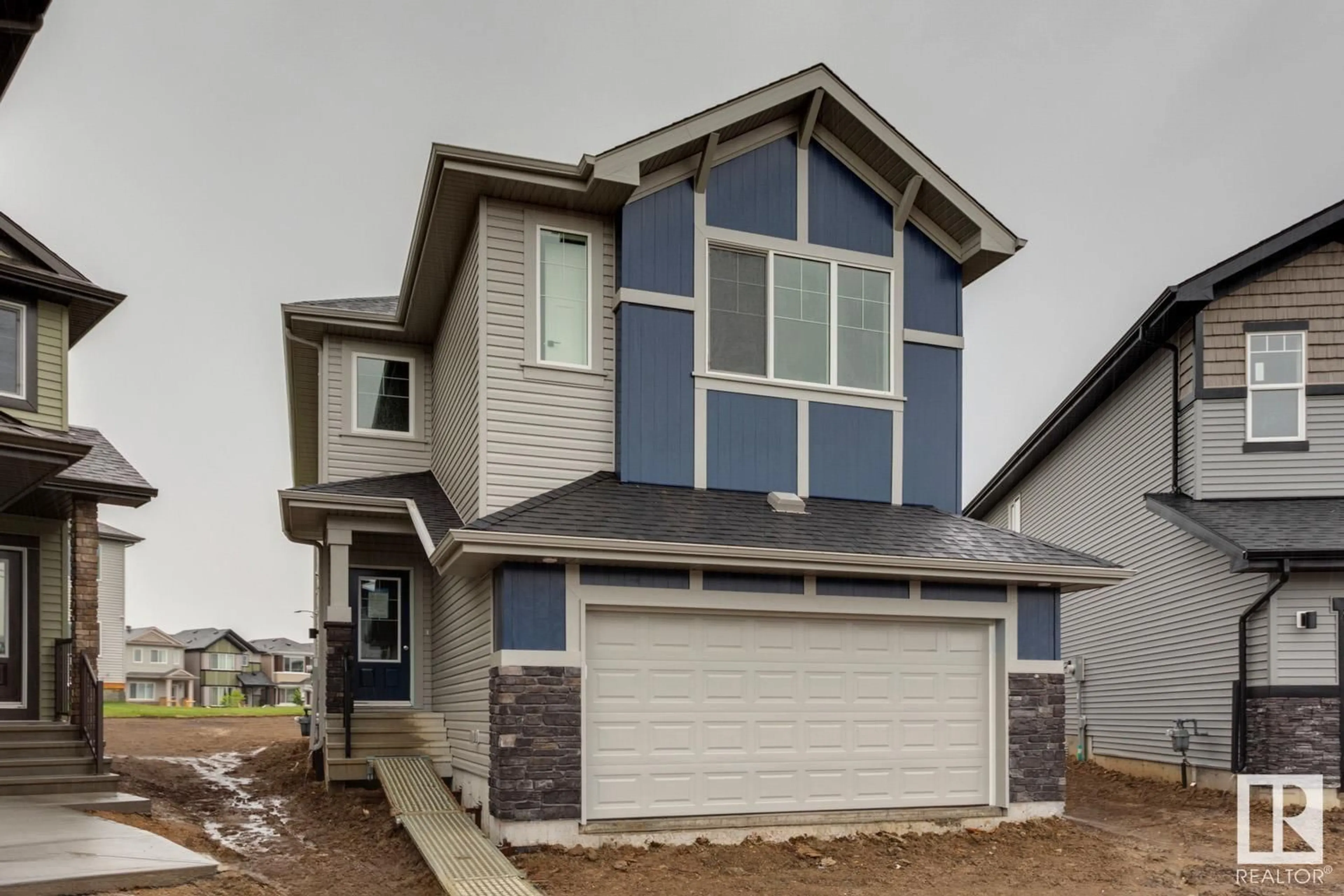 Home with vinyl exterior material, street for 1237 16A AV NW, Edmonton Alberta T6T2V1