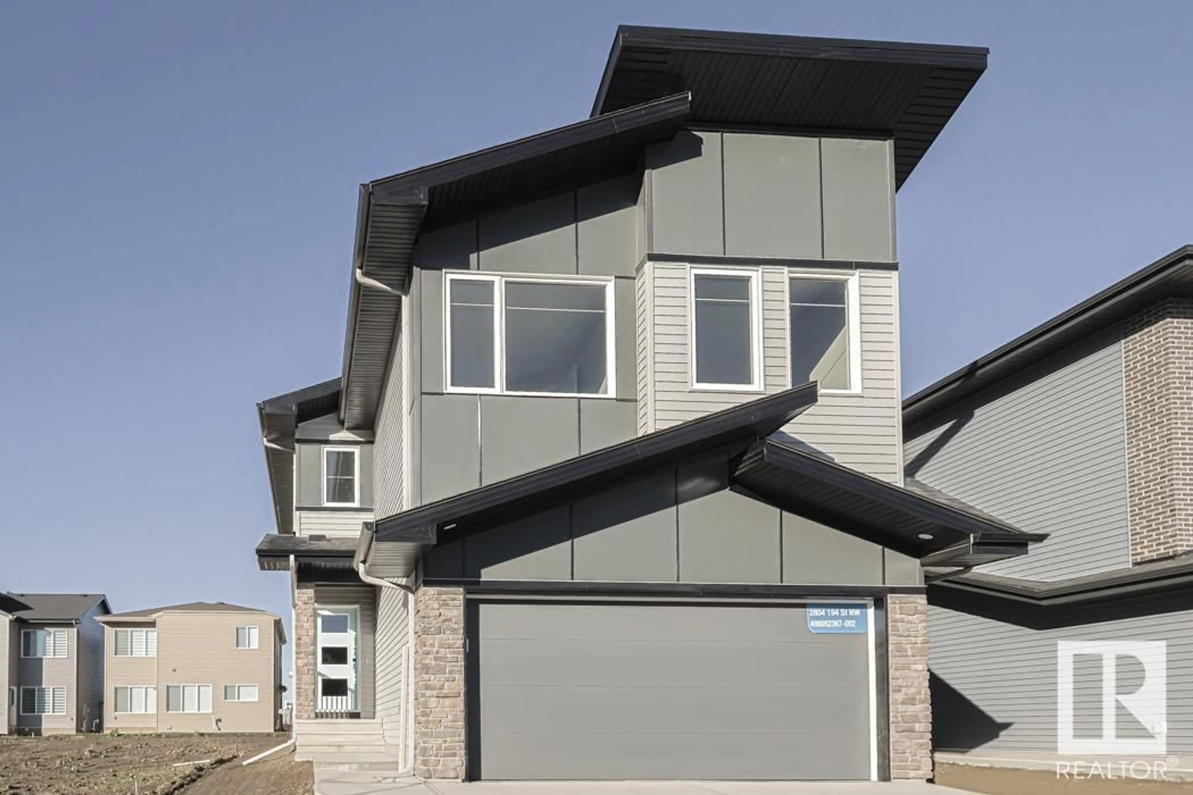 Home with vinyl exterior material, street for 2804 194 ST NW, Edmonton Alberta T6M2N6