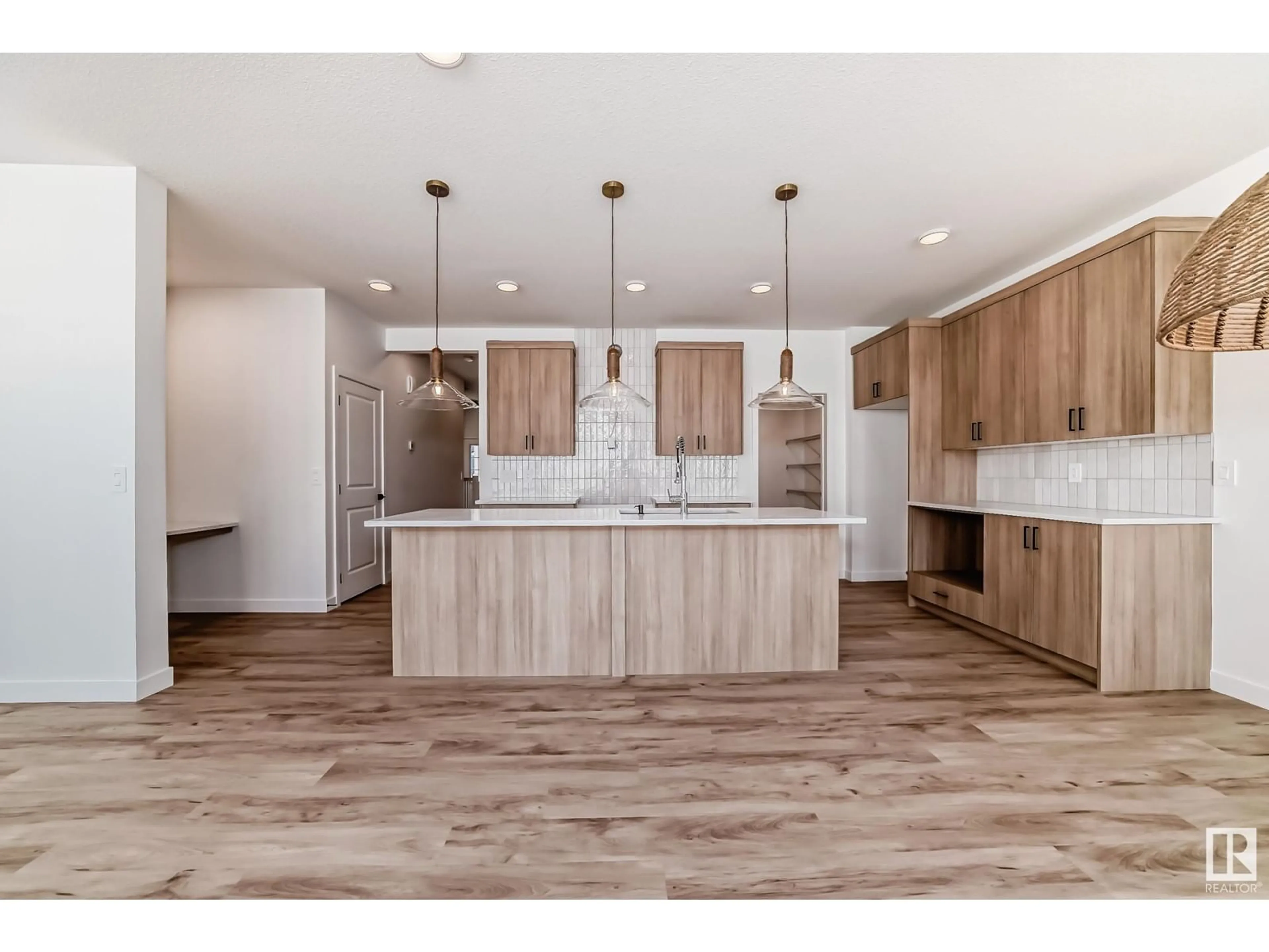 Open concept kitchen, wood/laminate floor for 3319 169 ST SW, Edmonton Alberta T6W5M3