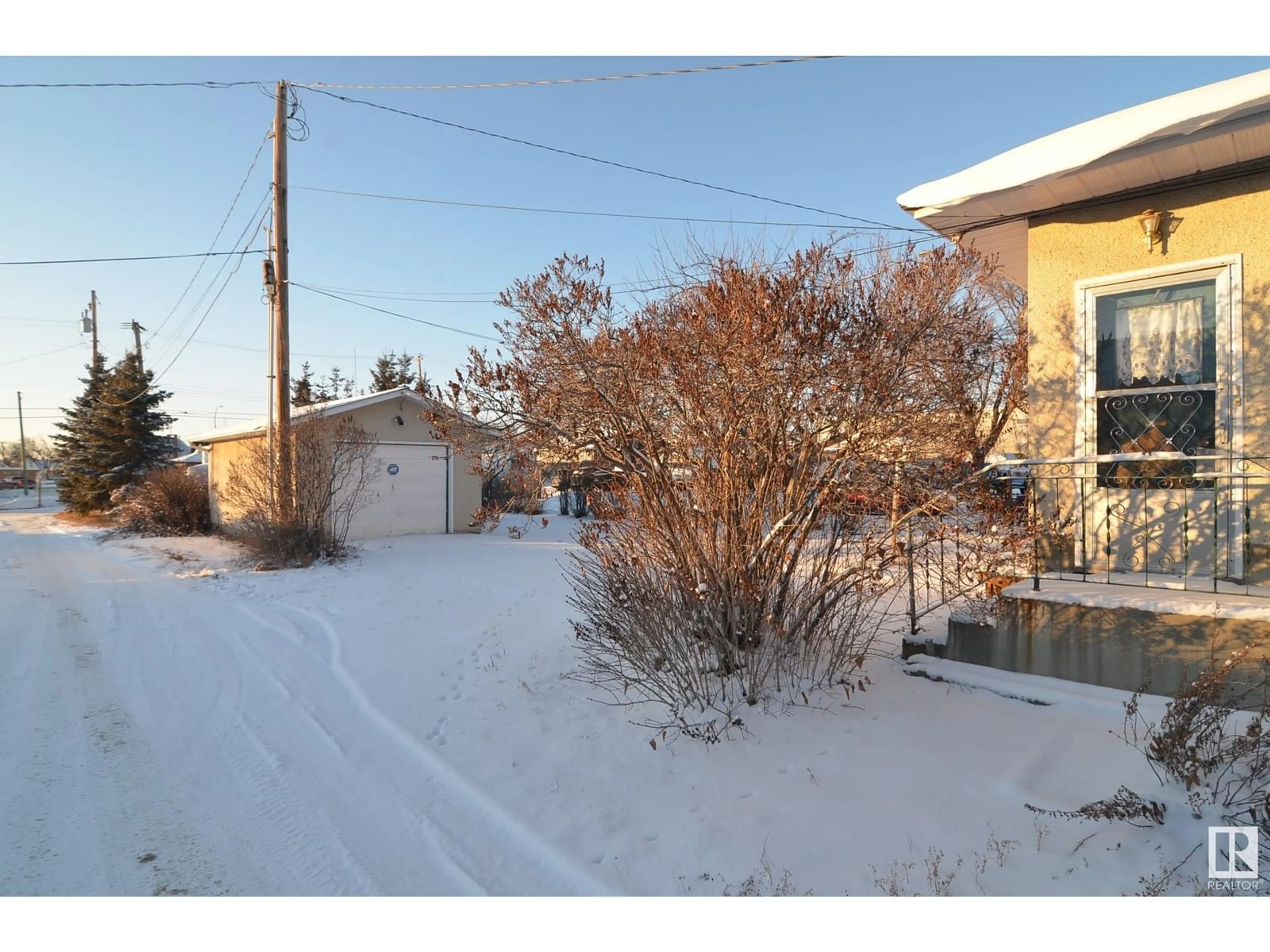 A pic from outside/outdoor area/front of a property/back of a property/a pic from drone, street for 5210 48 ST, Barrhead Alberta T7N1A3