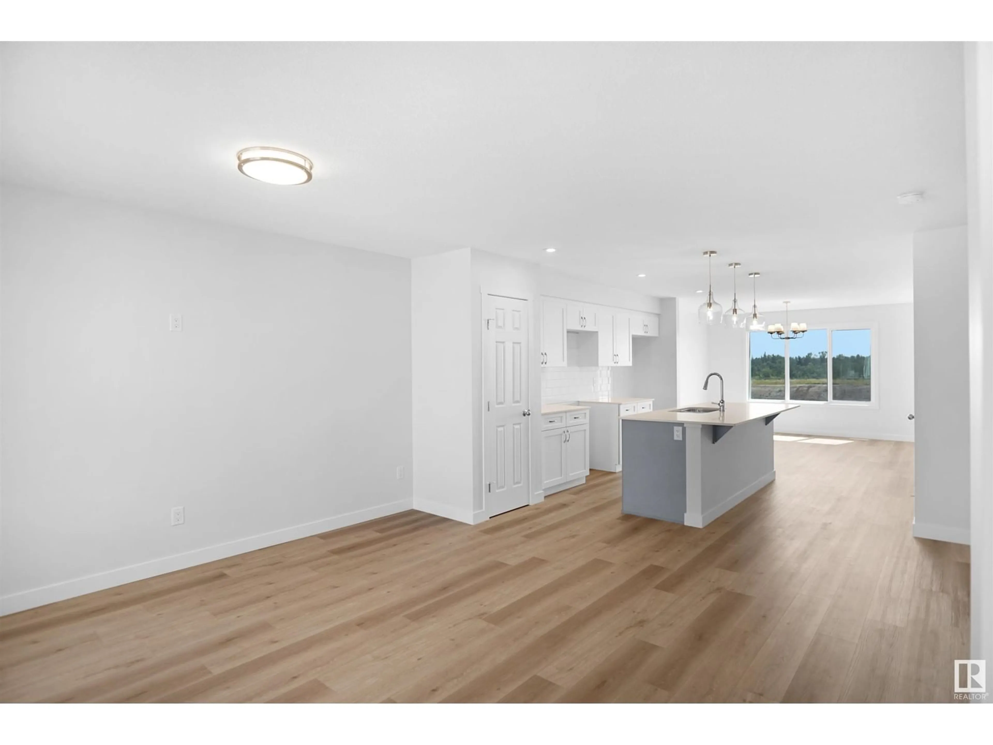 Open concept kitchen, wood/laminate floor for NW - 17358 6A ST, Edmonton Alberta T5Y4E8