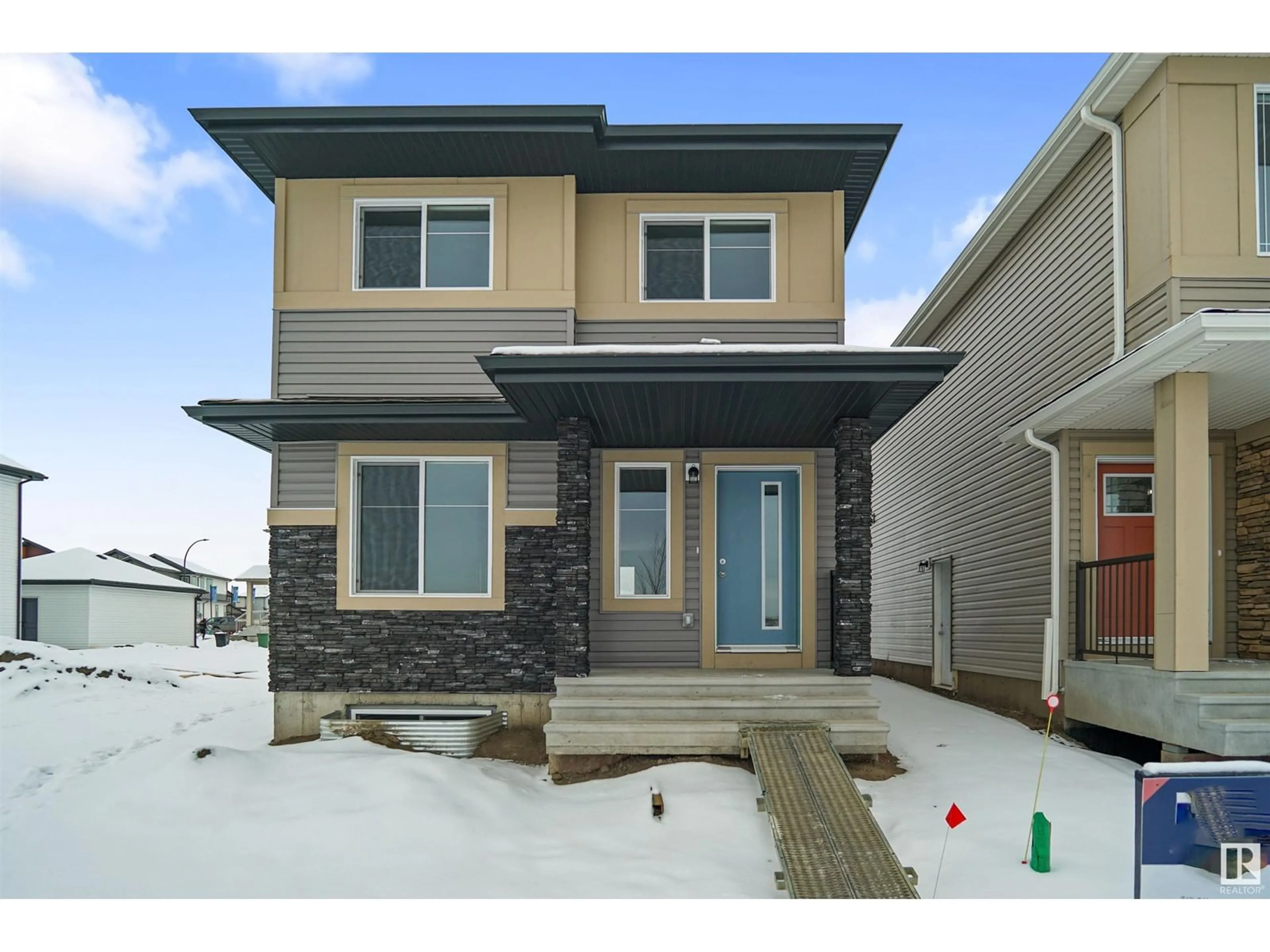 Home with vinyl exterior material, street for 17358 6A ST NW, Edmonton Alberta T5Y4E8