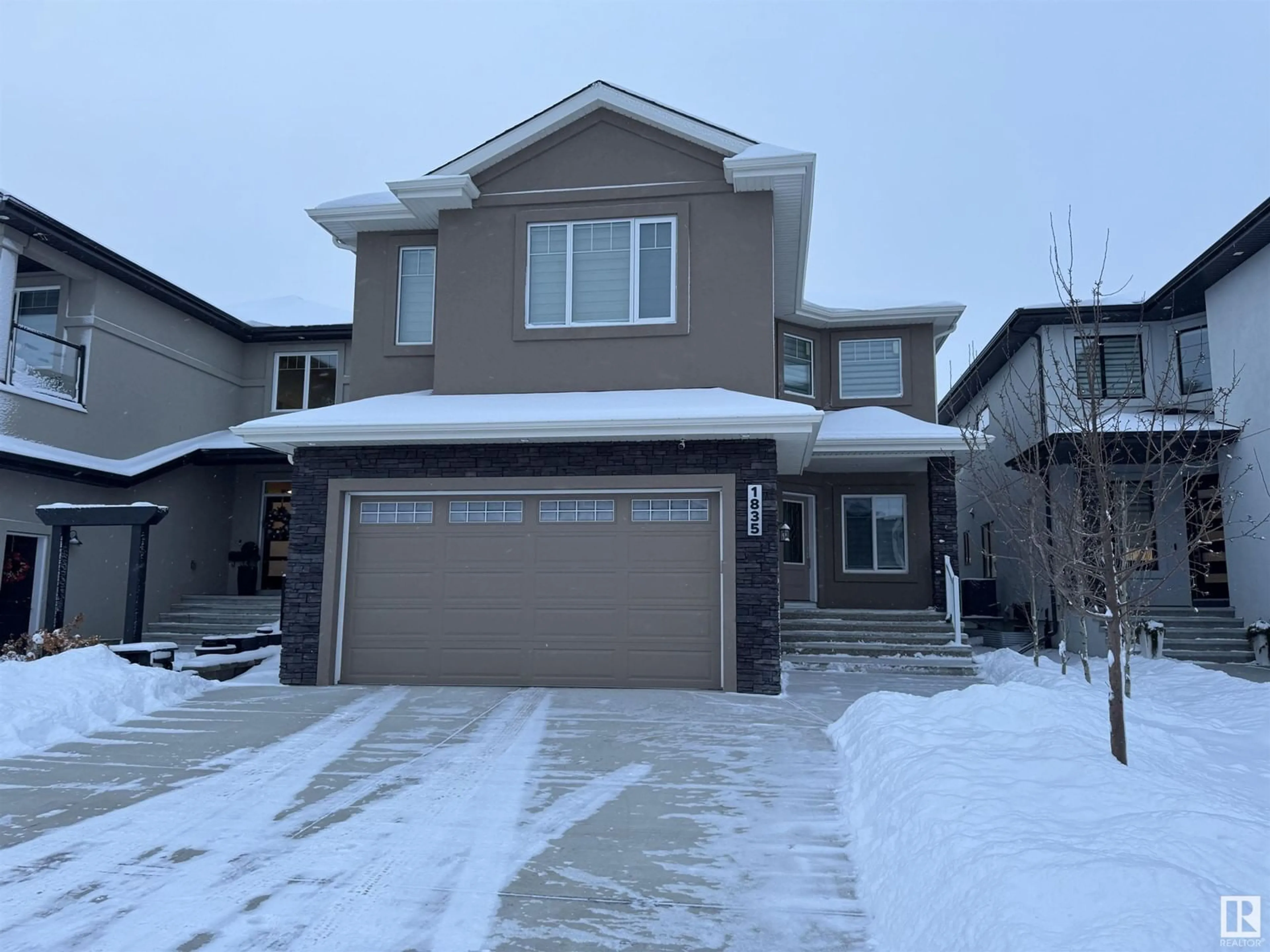 Home with vinyl exterior material, street for 1835 20Ave NW, Edmonton Alberta T6T2K9