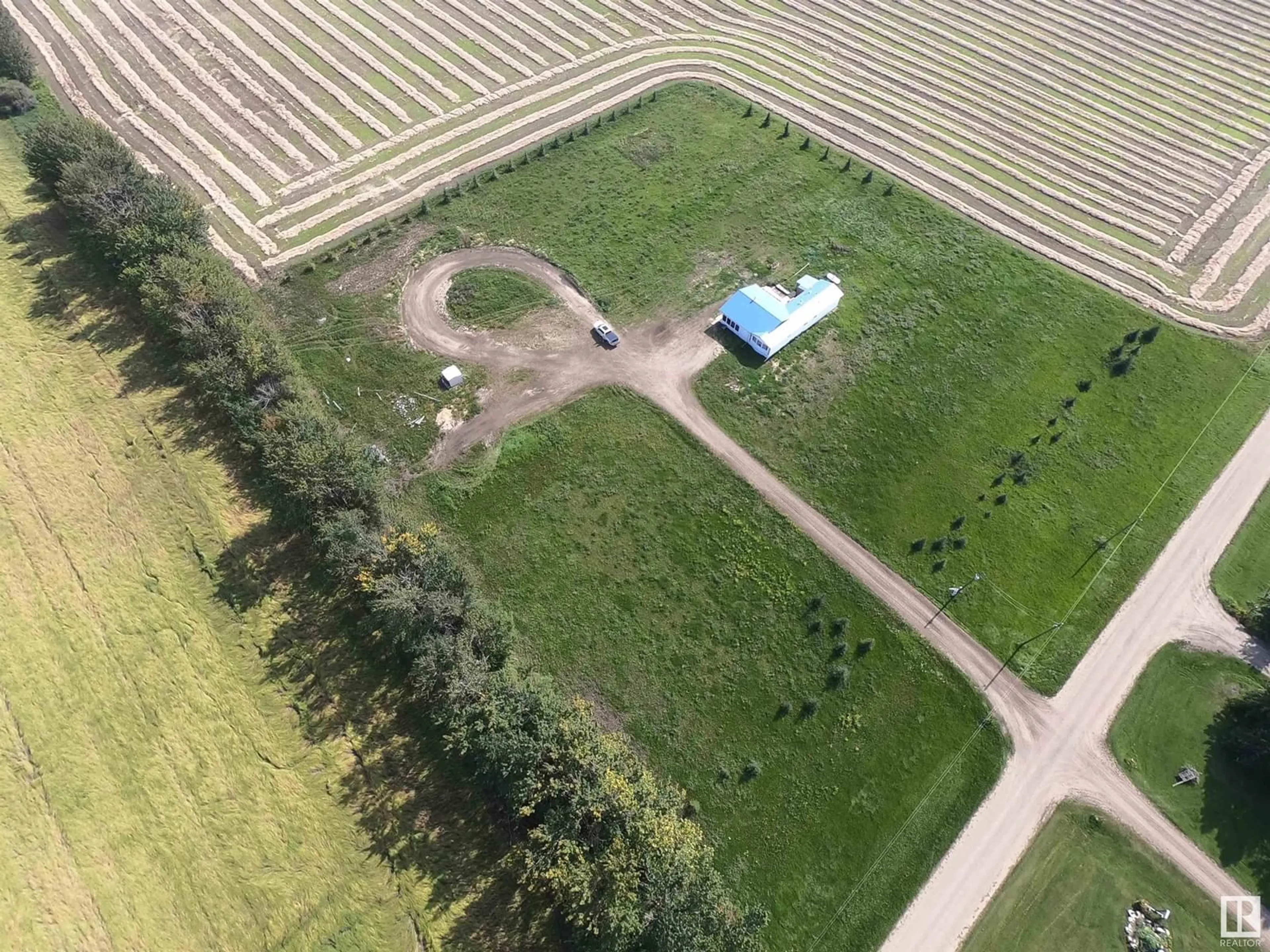 A pic from outside/outdoor area/front of a property/back of a property/a pic from drone, unknown for 61515 Rg Rd 261, Rural Westlock County Alberta T0G0S0