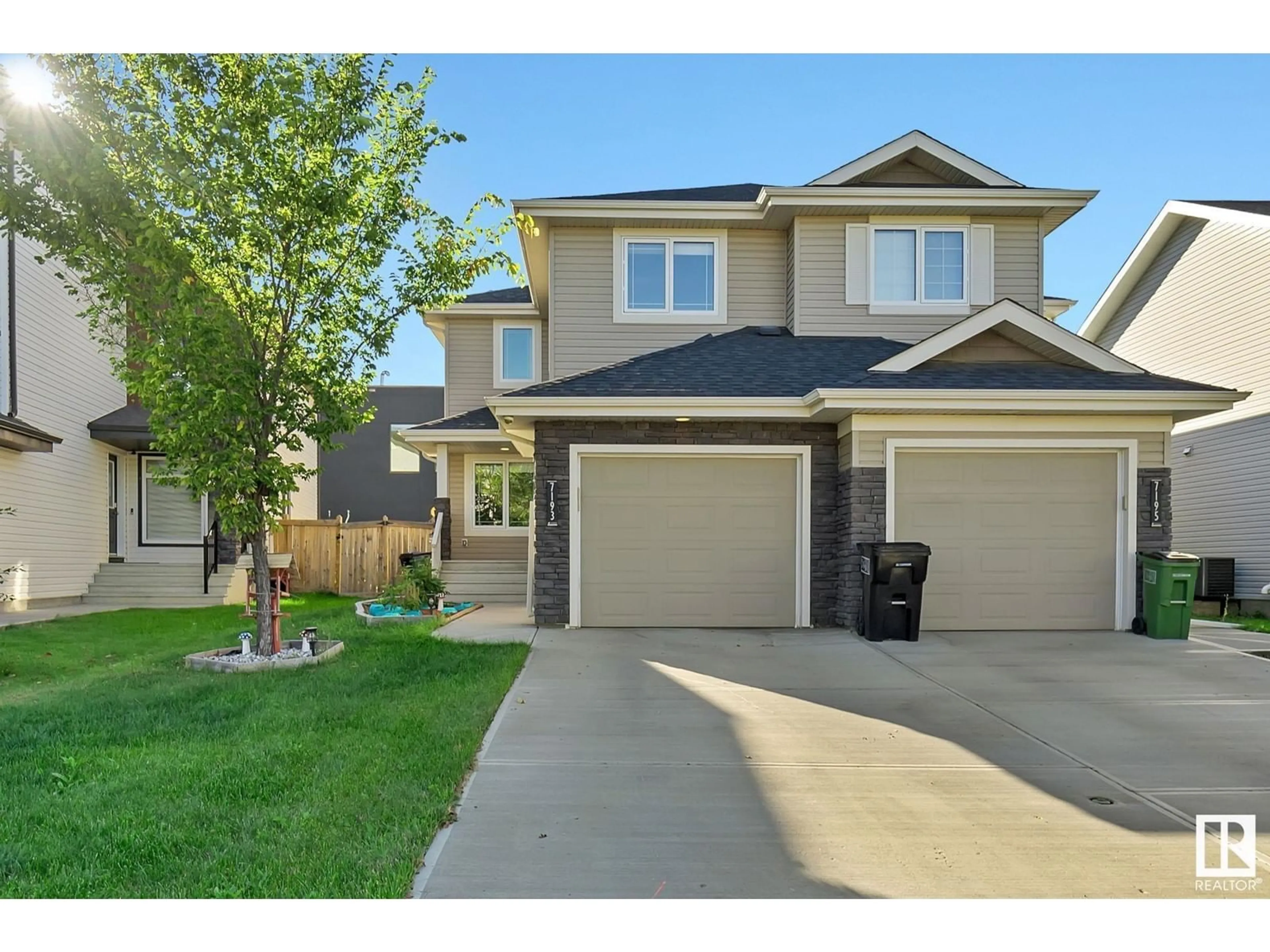 Home with vinyl exterior material, street for 7193 CARDINAL WY SW, Edmonton Alberta T6W2Y5