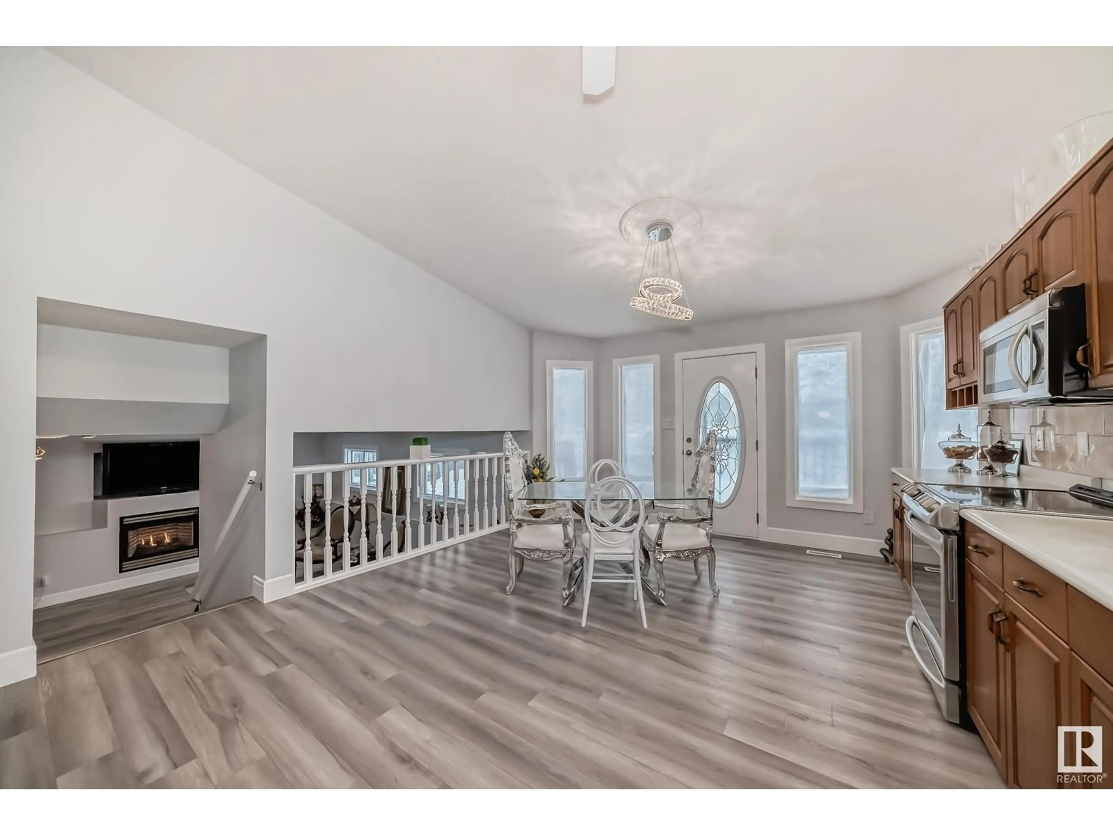 Open concept kitchen, wood/laminate floor for 10735 BEAUMARIS RD NW, Edmonton Alberta T5X5P1