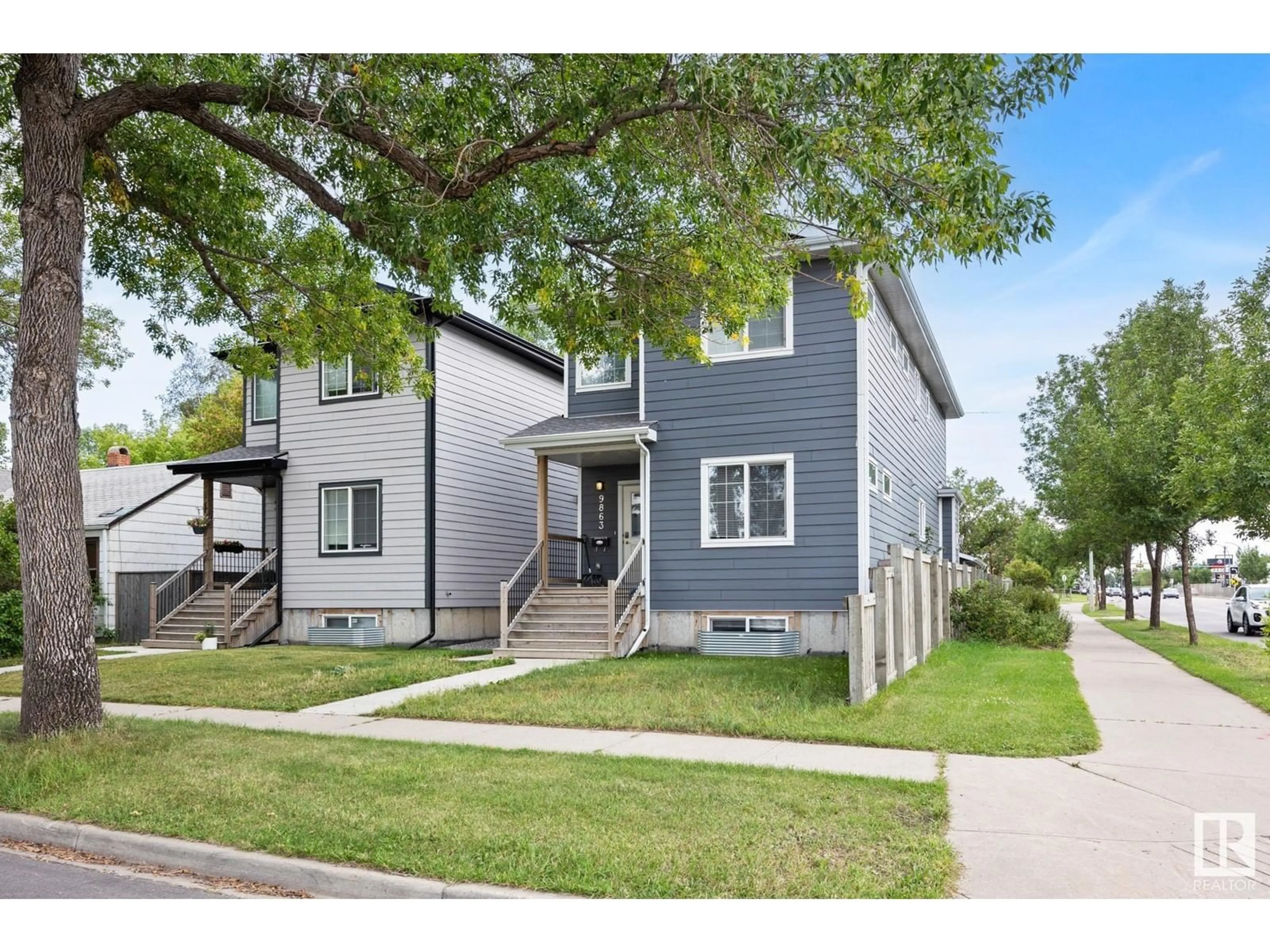 Home with vinyl exterior material, street for 9863 73 AV NW, Edmonton Alberta T6E1B7