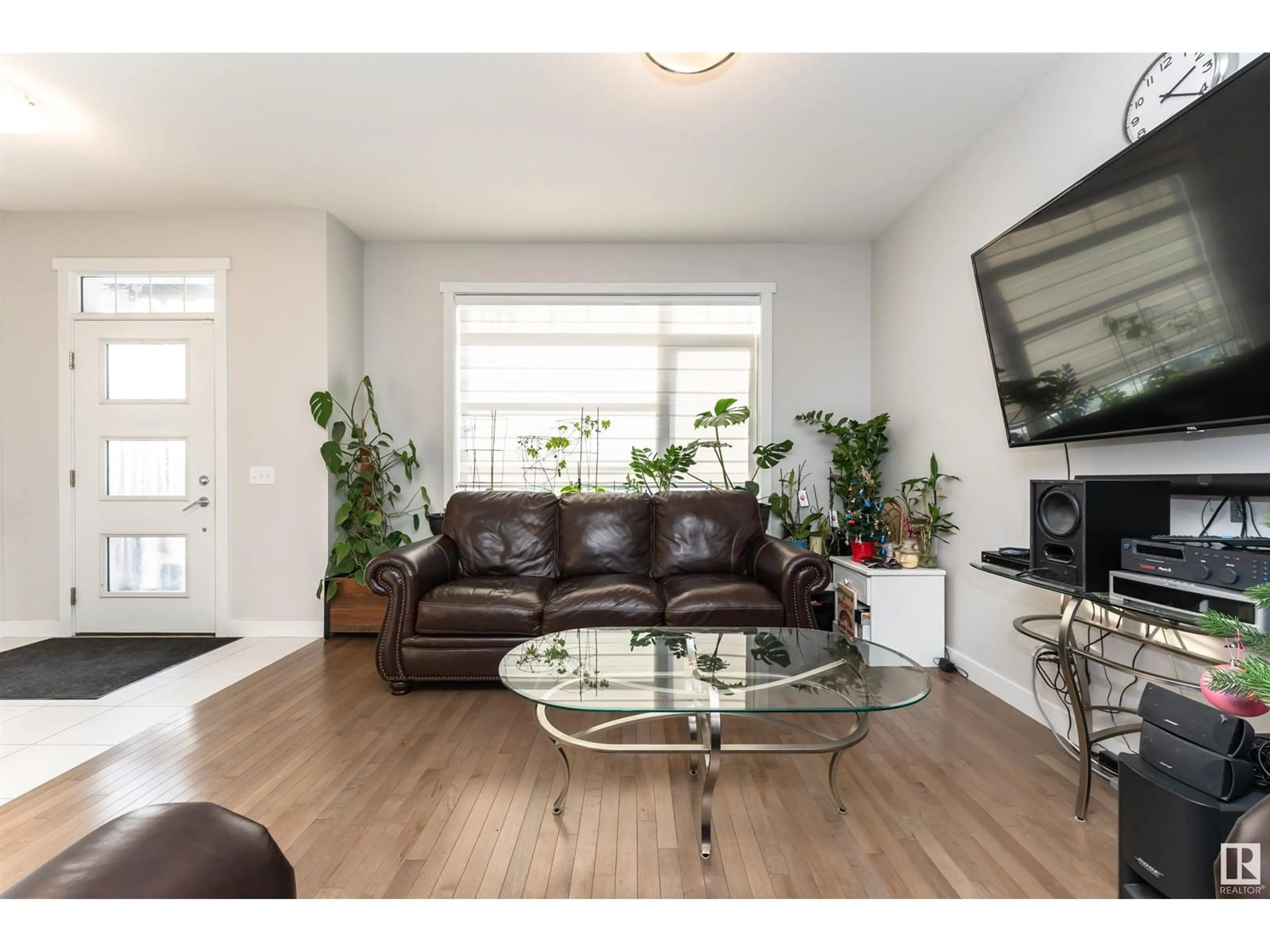 Living room with furniture, wood/laminate floor for 22628 97 AV NW, Edmonton Alberta T5T7J2