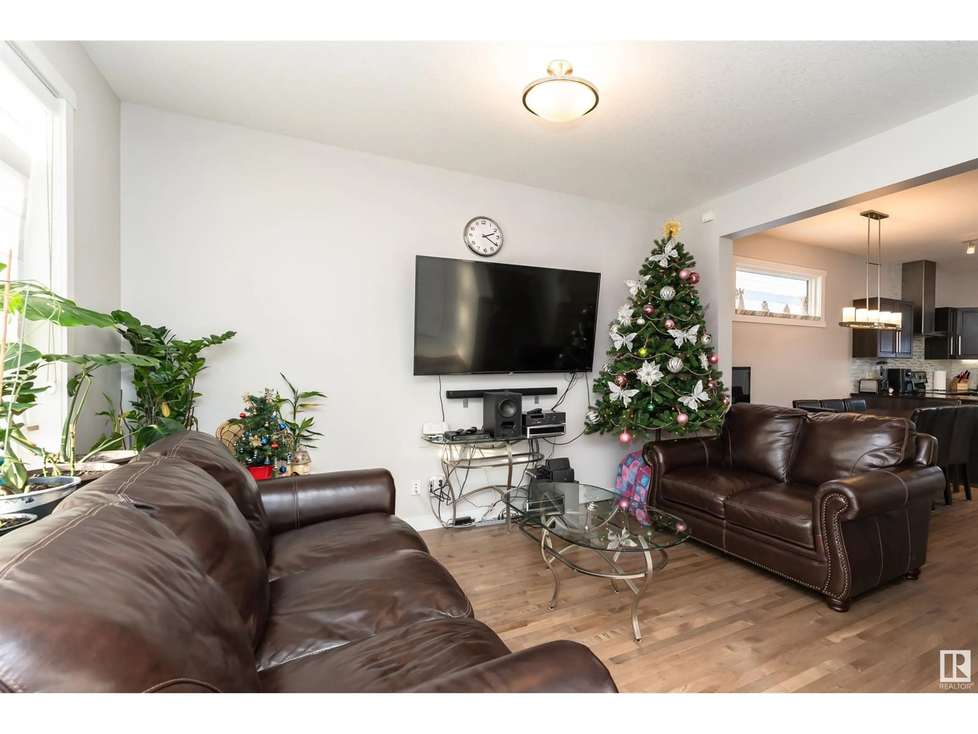 Living room with furniture, wood/laminate floor for 22628 97 AV NW, Edmonton Alberta T5T7J2